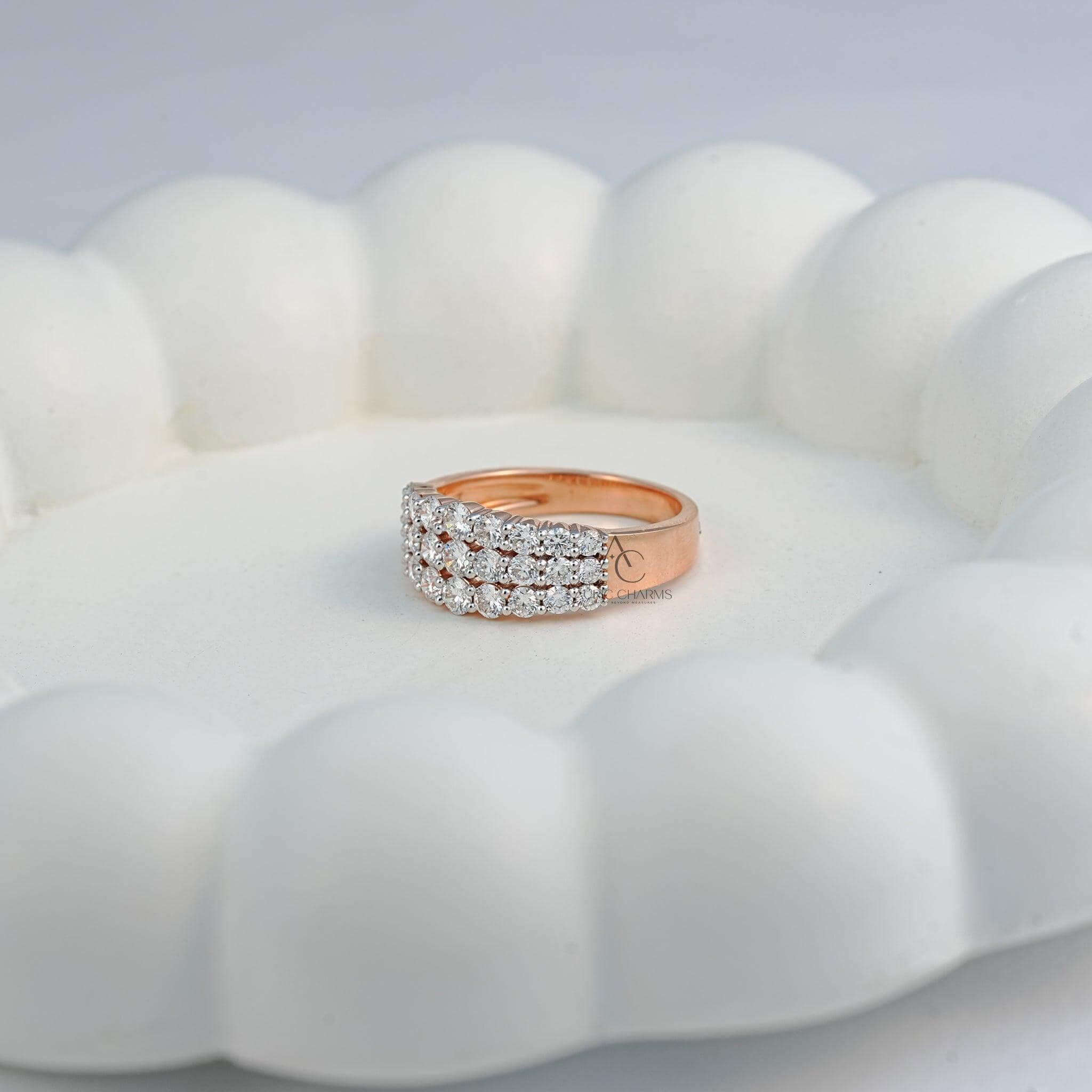 Side view of three-row lab-grown diamond ring on white background