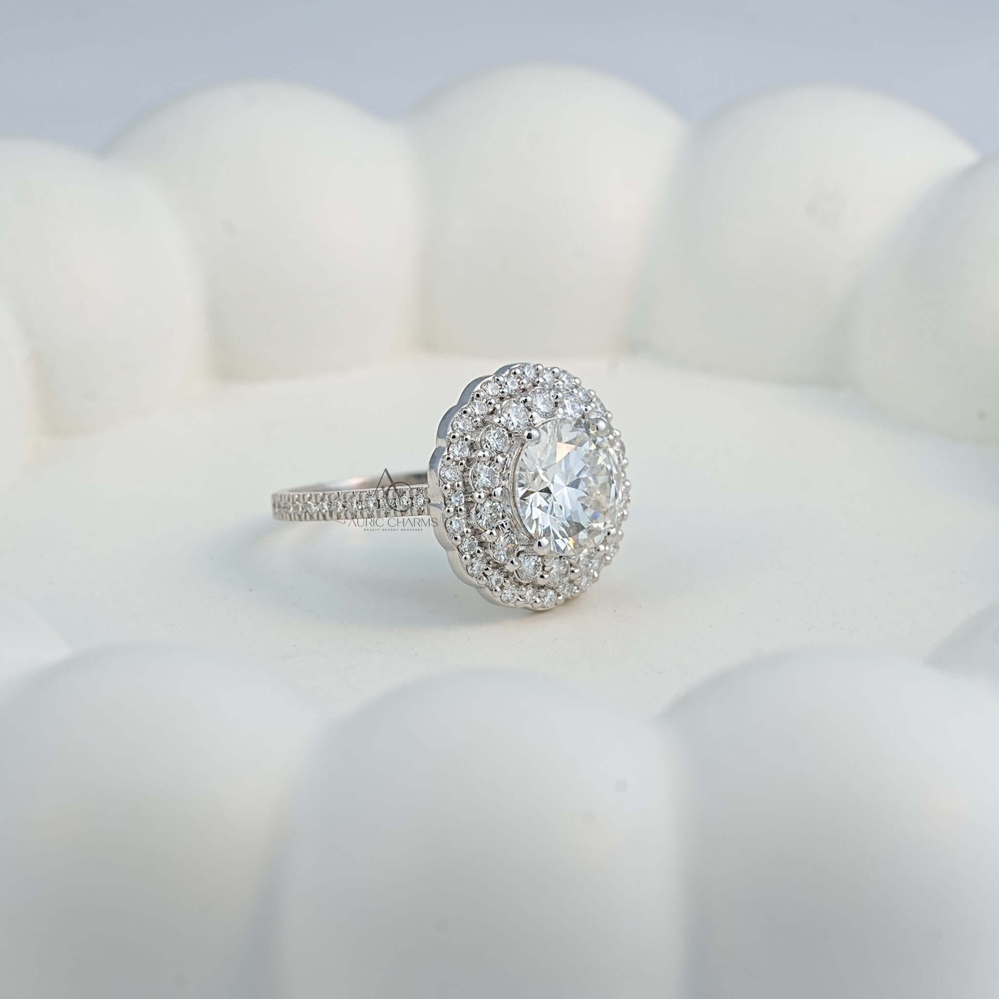 Side profile of lab-grown diamond halo ring displayed on a ceramic