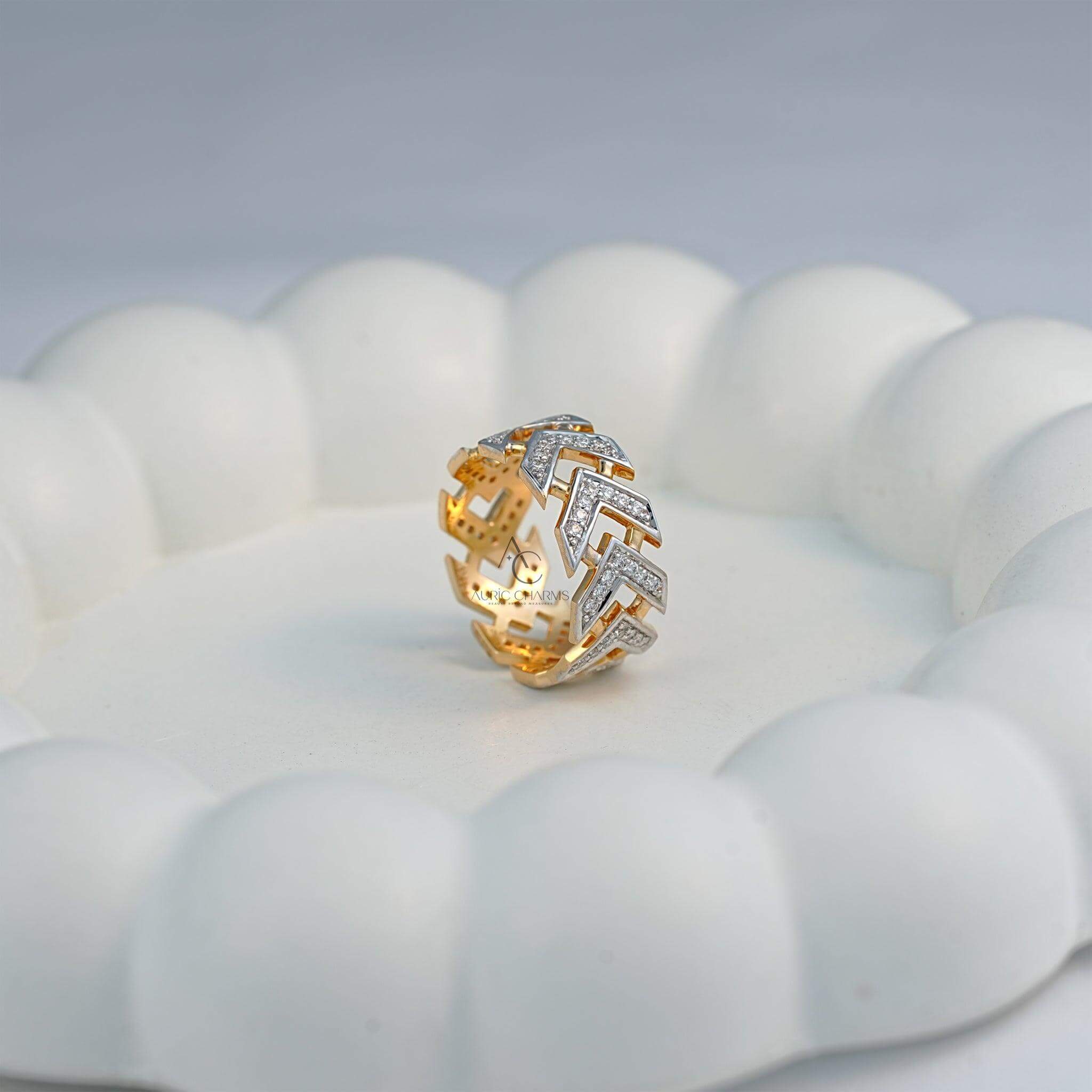Chevron lab-grown diamond ring displayed on a white cushion surface.