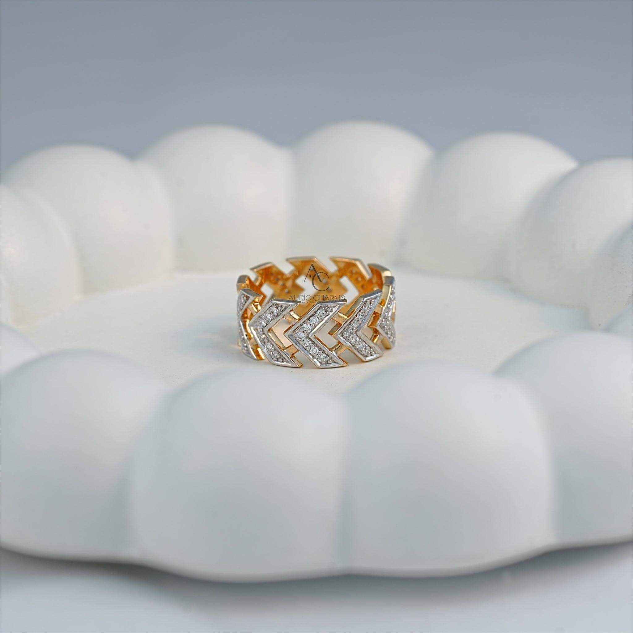 Gold chevron diamond ring featuring lab-grown diamonds on a white backdrop.