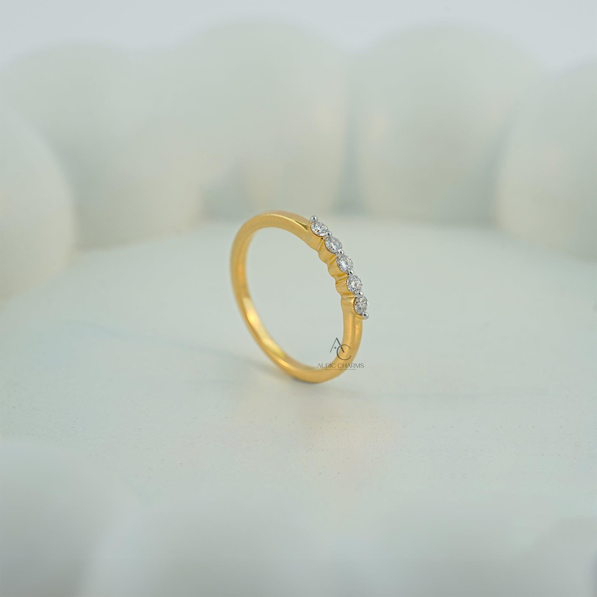 Elegant gold and diamond ring featuring sustainable lab-grown diamonds in a sleek design.