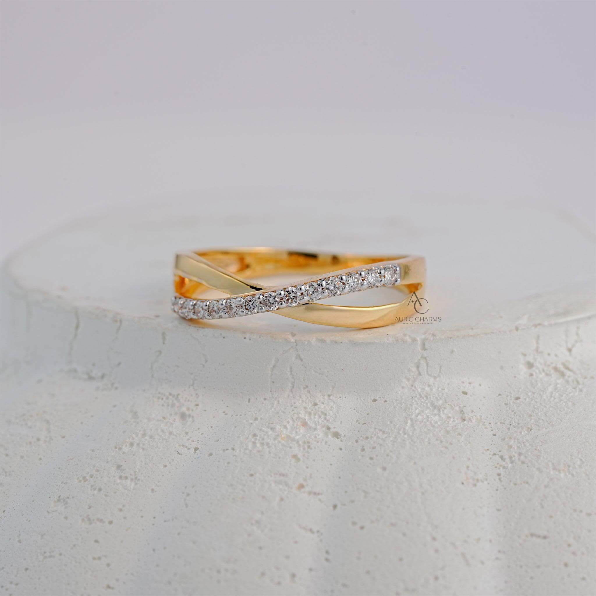 Elegant yellow gold ring with a crisscross diamond-studded band, perfect for gifting.
