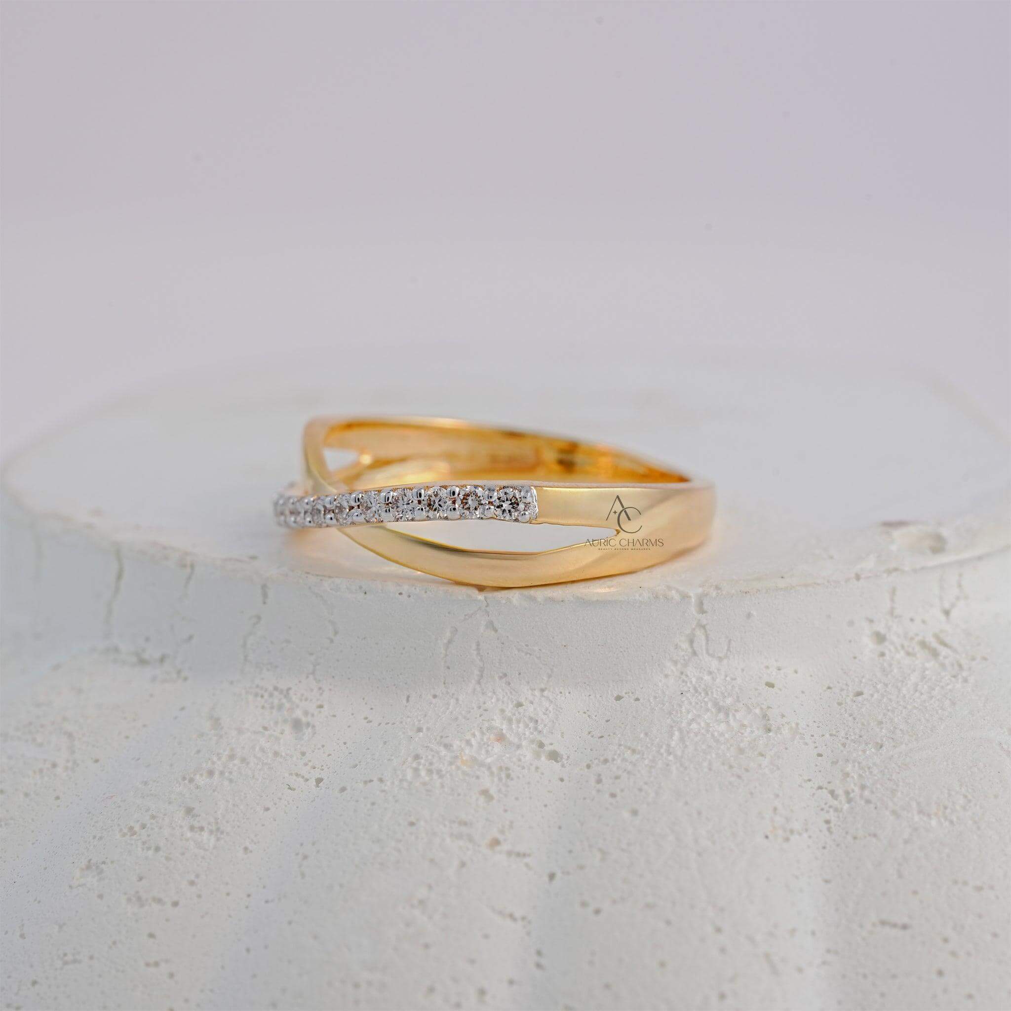 Stylish yellow gold crisscross ring adorned with sparkling lab-grown diamonds.