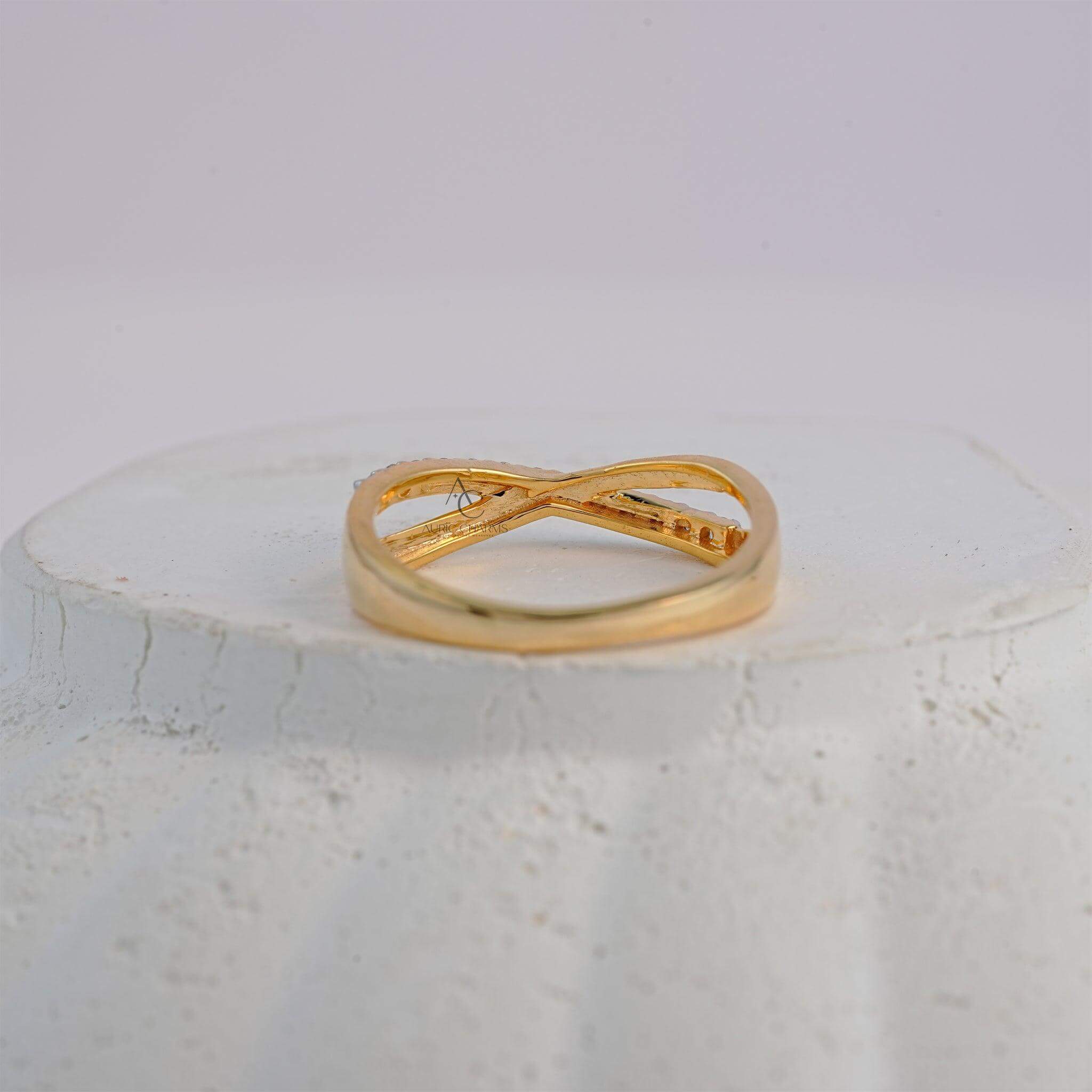 Rear view of yellow gold crisscross diamond ring, showcasing unique band detailing.