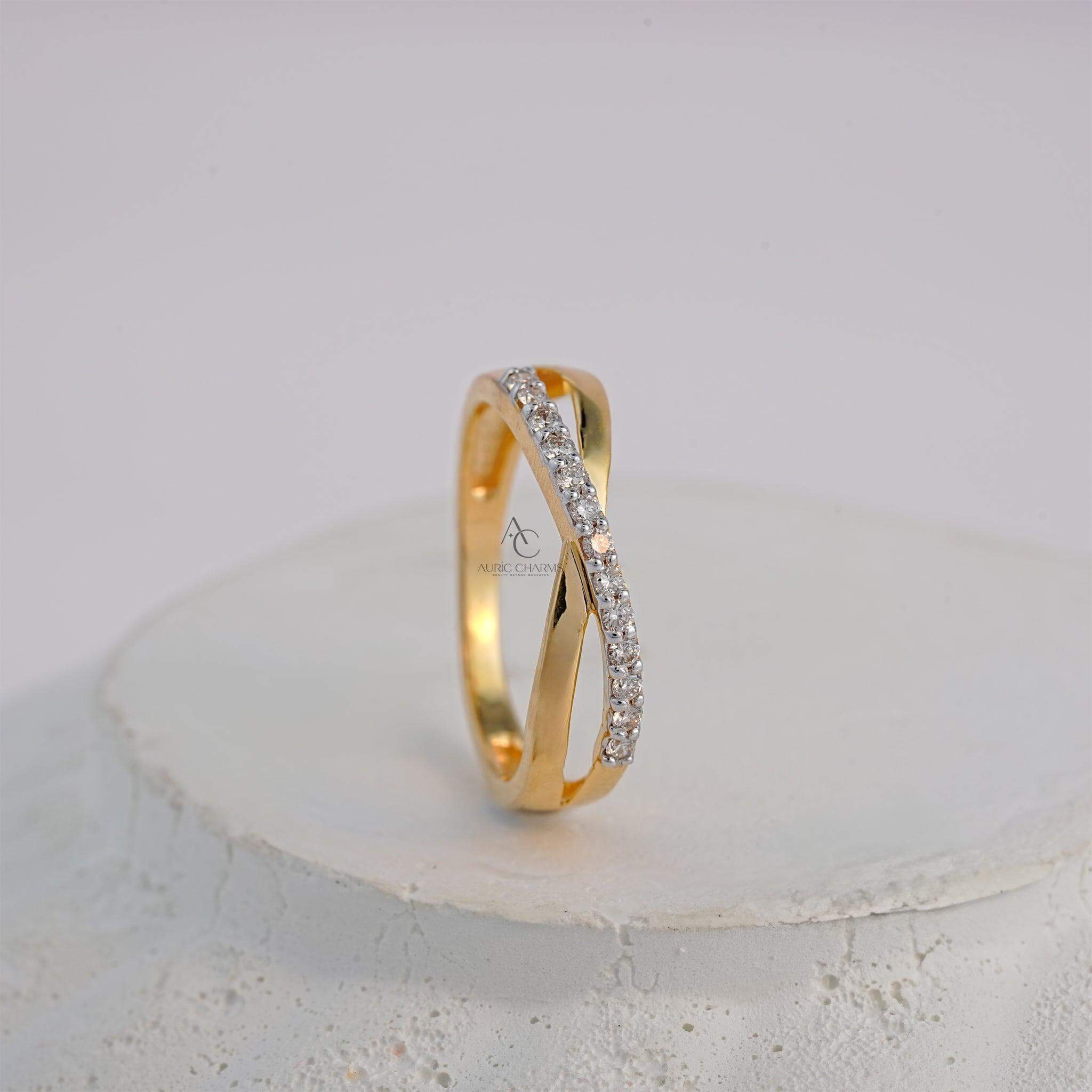 Side profile of a yellow gold crisscross ring with lab-grown diamonds in a modern design.