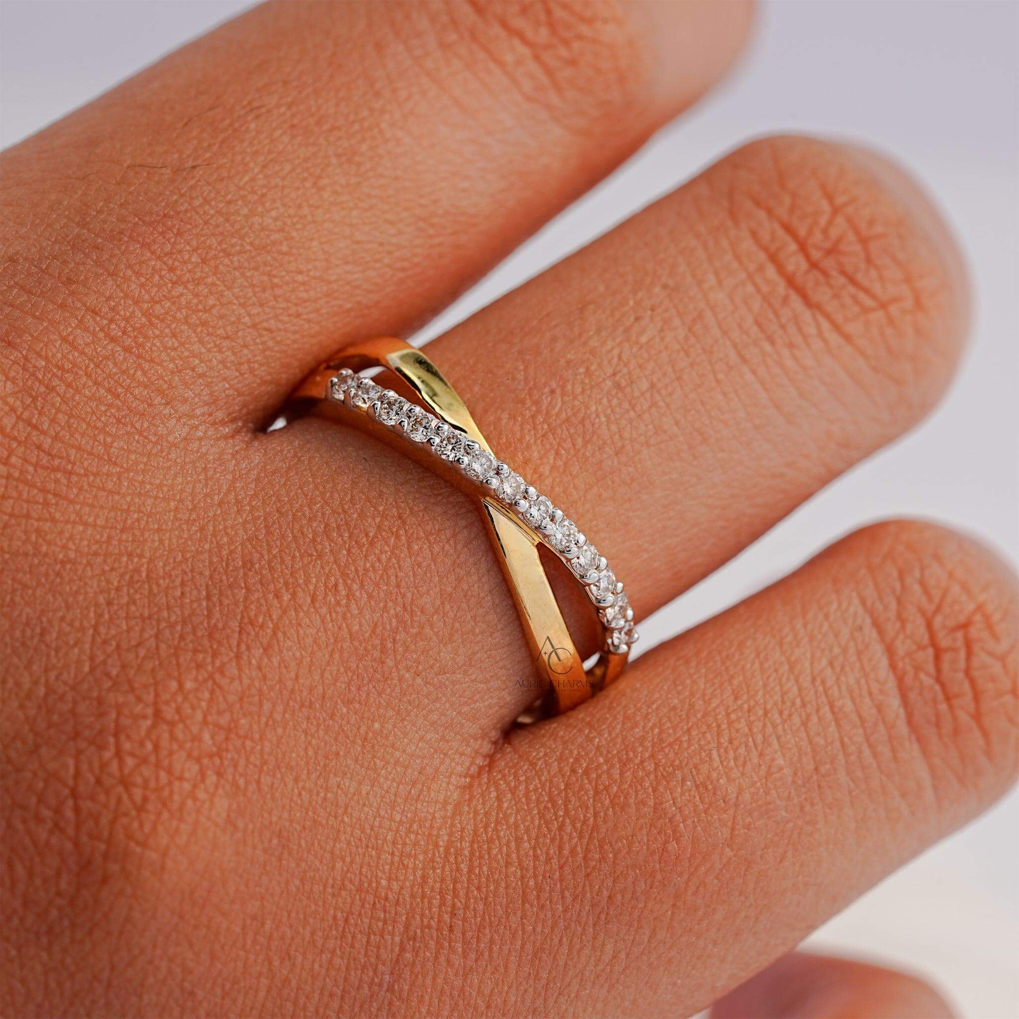  Side profile of a gold diamond crisscross ring, radiating sophistication.