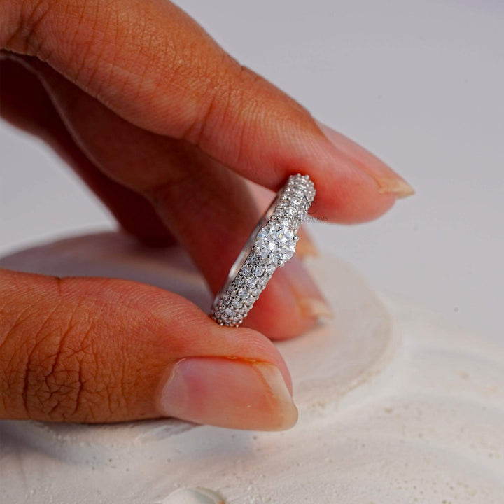 Another view of the diamond pavé ring on a hand model, showcasing the luxurious design and impeccable craftsmanship.