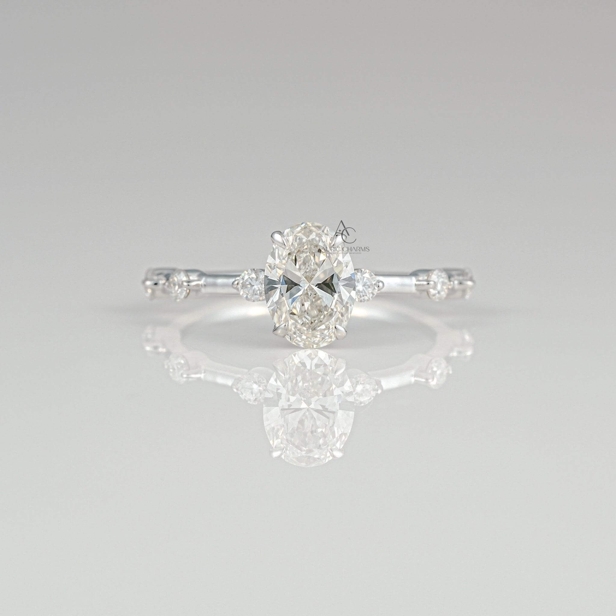 Front view of an elegant lab-grown oval-cut diamond engagement ring set on a delicate band with scattered diamonds, reflecting sophistication and charm.