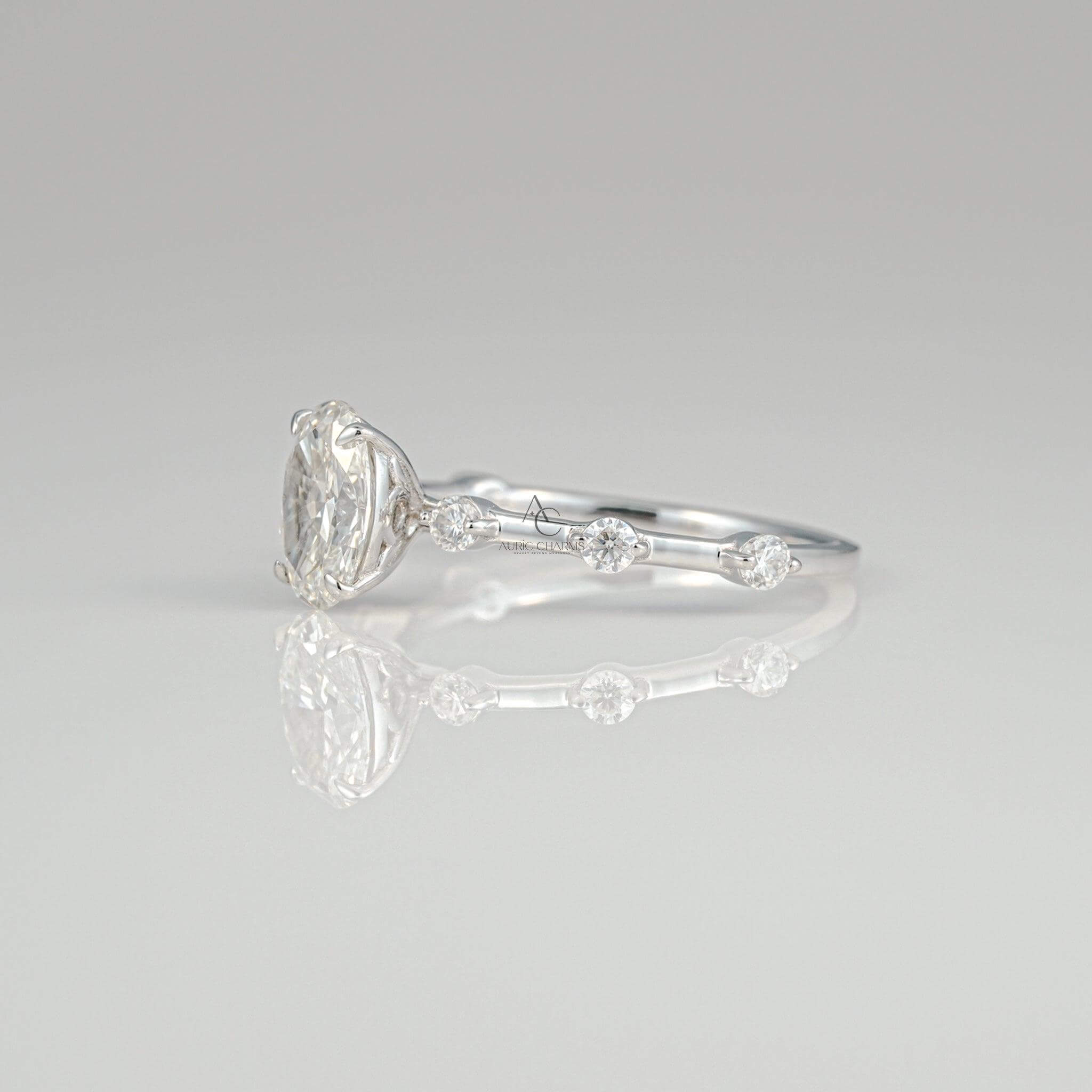 Close-up back view of an oval diamond ring with a minimalist band, highlighting the diamond's brilliance and expert craftsmanship