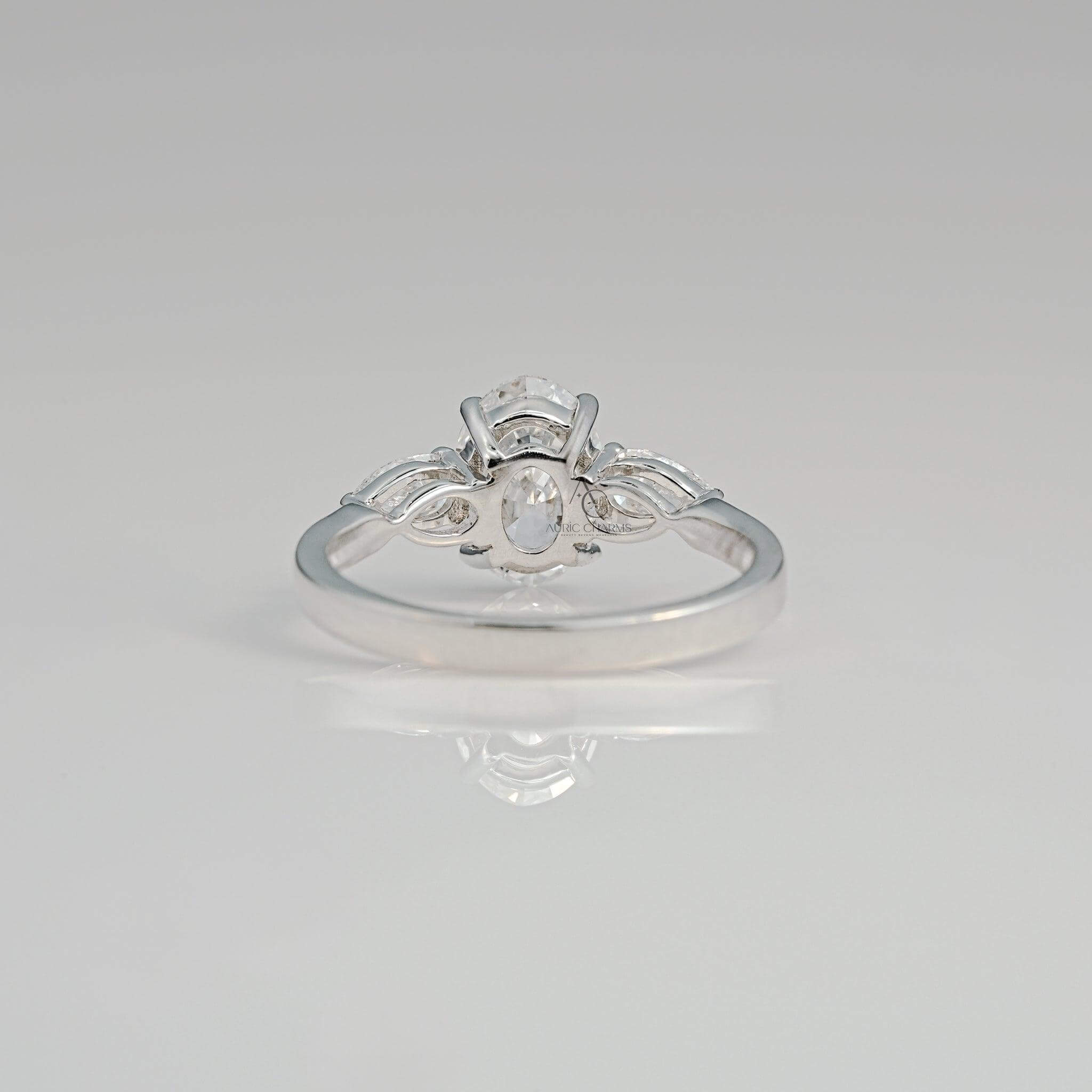 Back view of a luxurious oval diamond ring with intricate white gold detailing.
