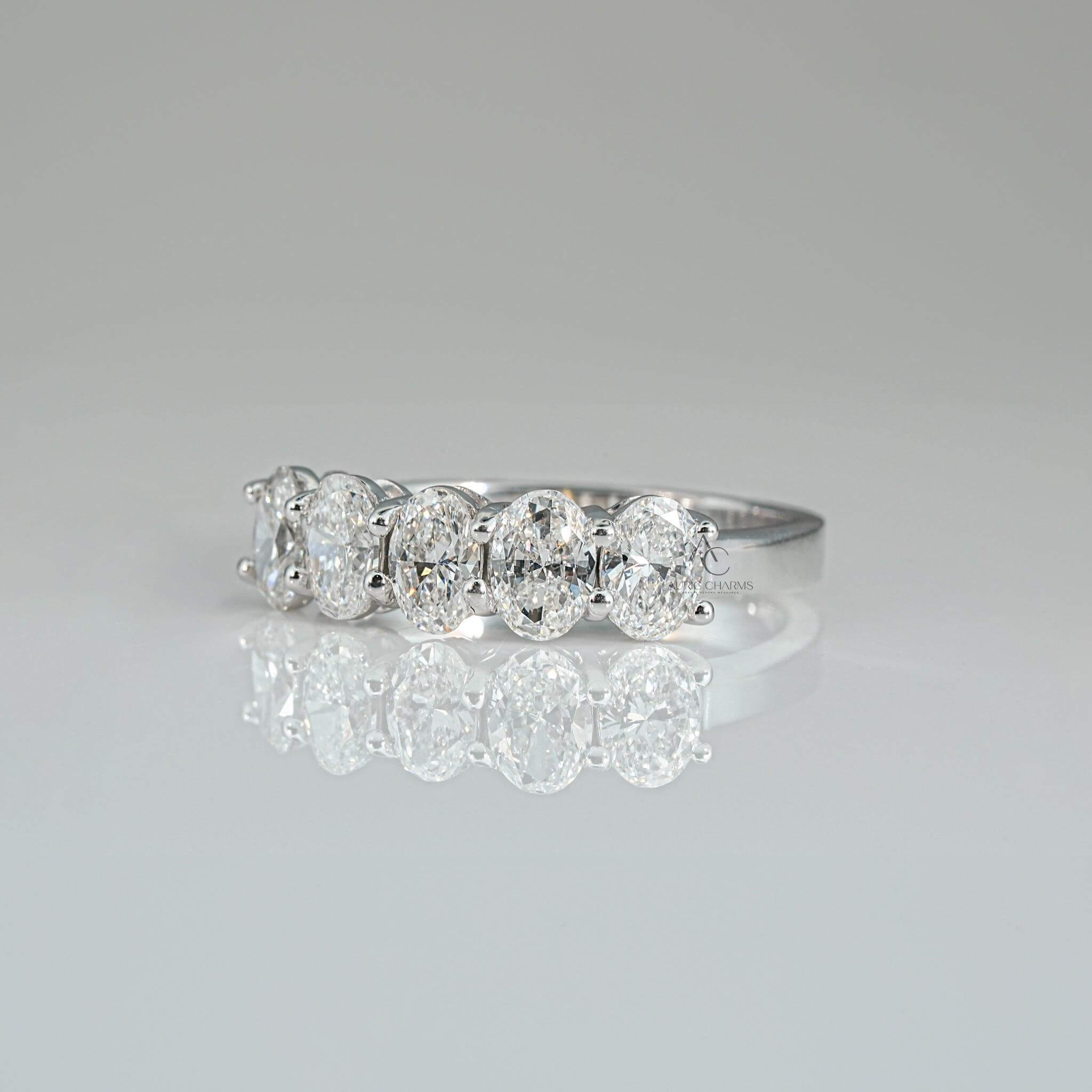 Five-stone diamond band ring featuring brilliant oval lab-grown diamonds in white gold.