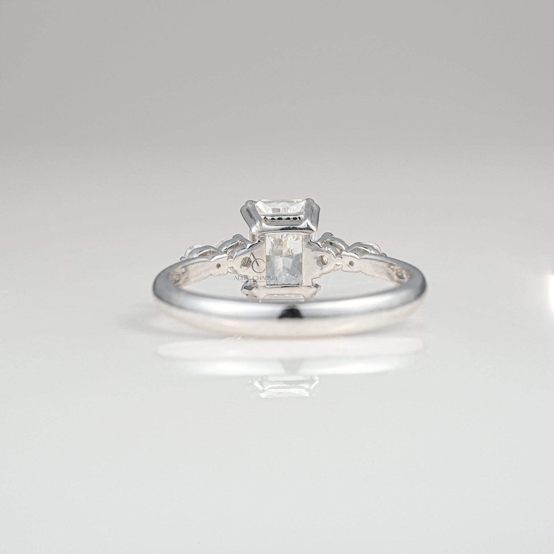 Back view of a radiant-cut diamond ring showcasing the intricate white gold setting.