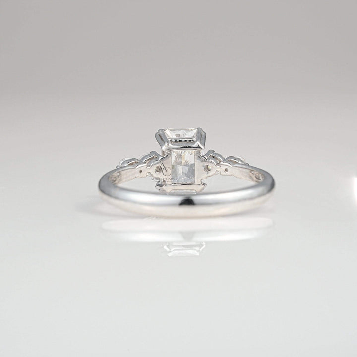 Back view of a radiant-cut diamond ring showcasing the intricate white gold setting.