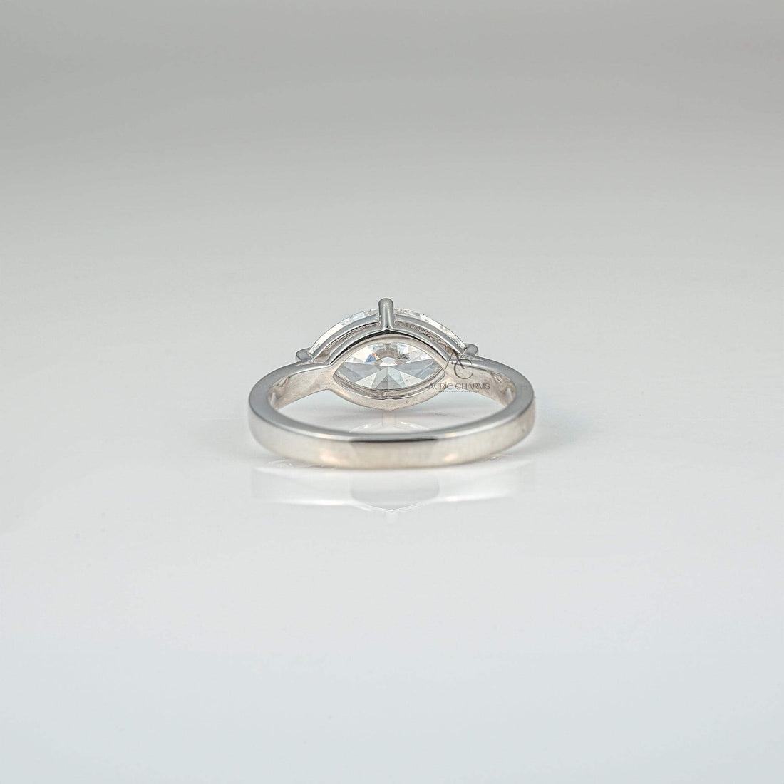 Rear view of a marquise-cut diamond solitaire ring showcasing the minimalistic design.