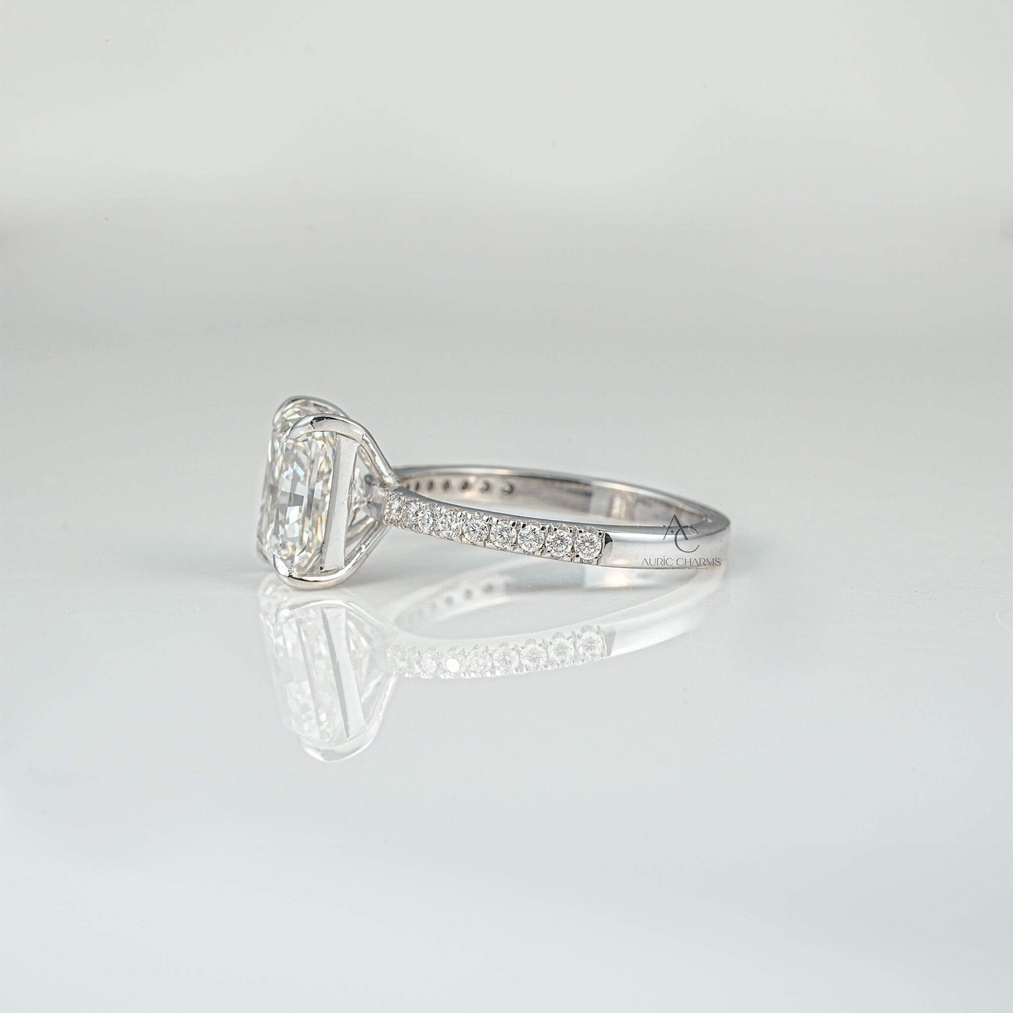 Close-up of a radiant-cut diamond ring with a minimalist prong setting.