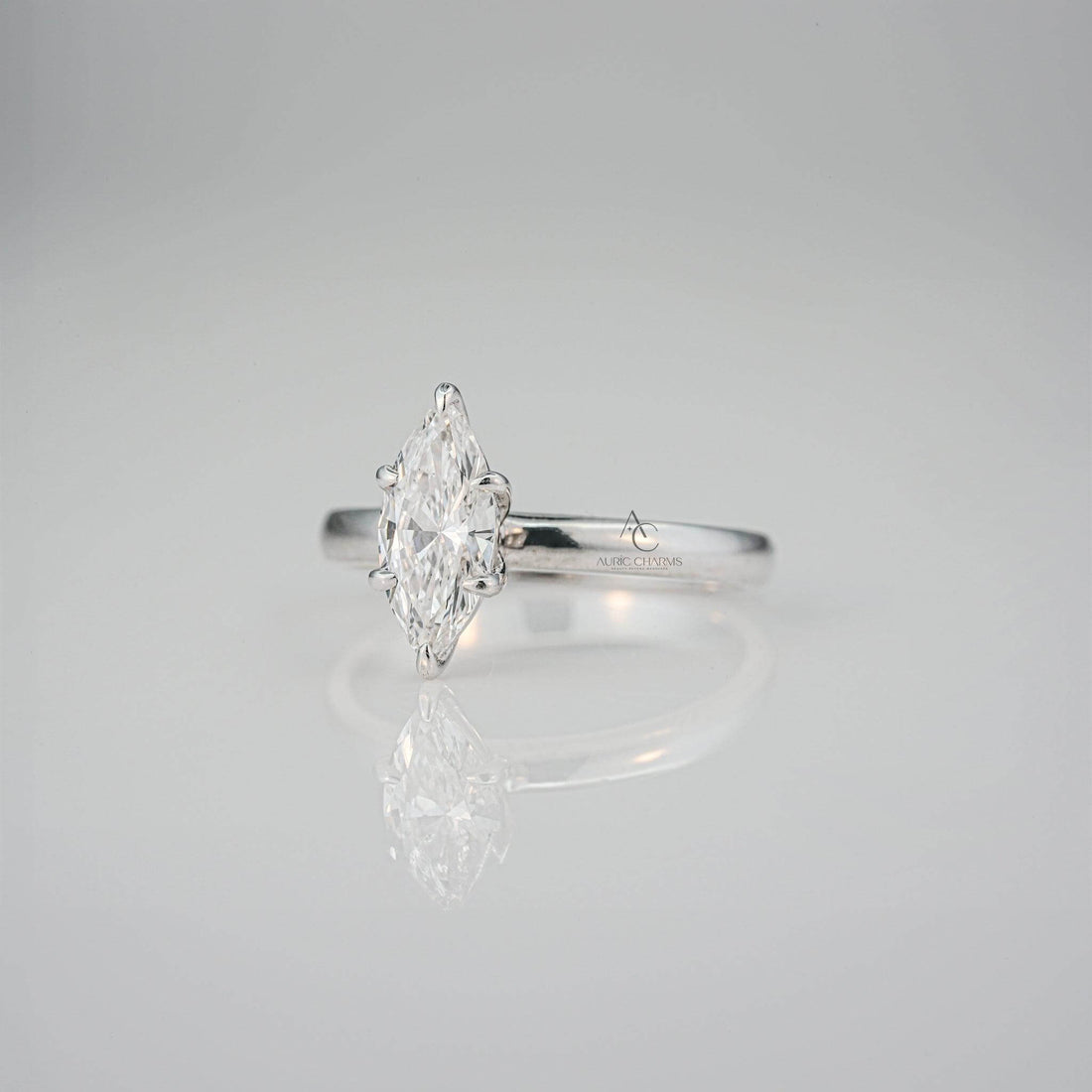Angled view showcasing the elegance of the marquise-cut diamond solitaire ring with a reflective polished band.