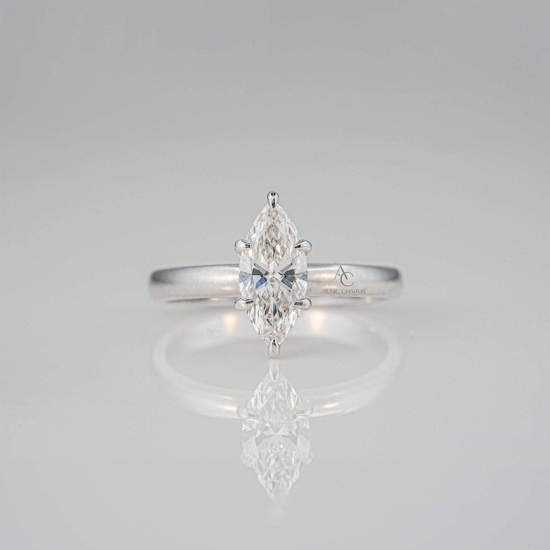 Top view of the marquise-cut diamond solitaire ring highlighting the intricate prong setting and central stone brilliance.