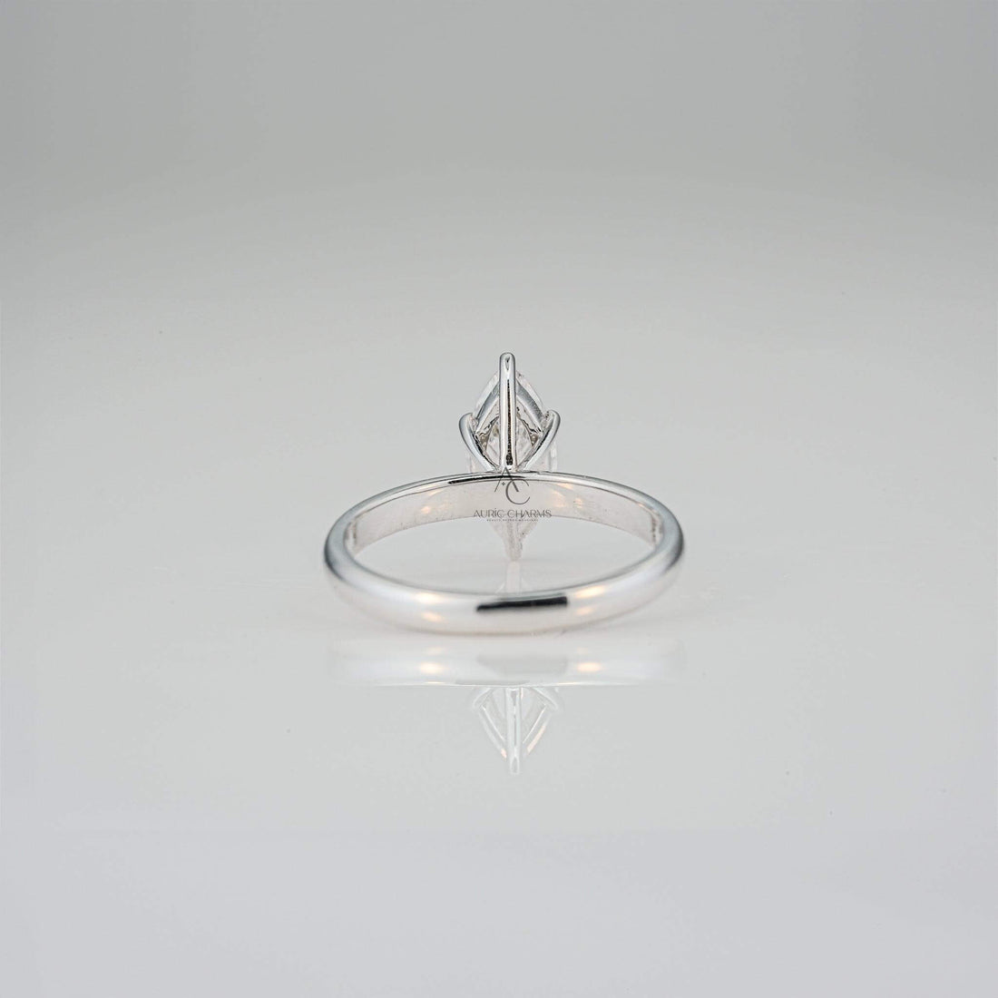 Rear view of the marquise-cut diamond solitaire ring emphasizing the supportive setting and smooth band finish.