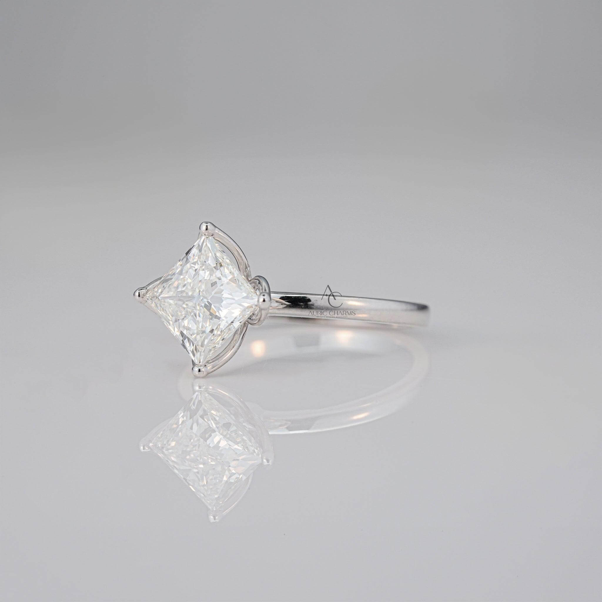 Side profile of square diamond floral ring in platinum setting.