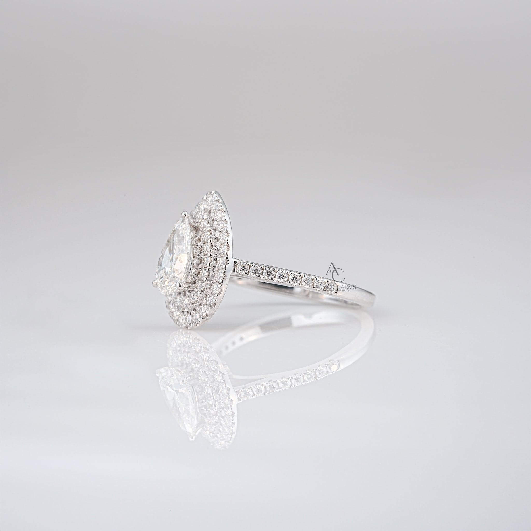 Profile of a pear-shaped diamond ring highlighting the layered double halo design.