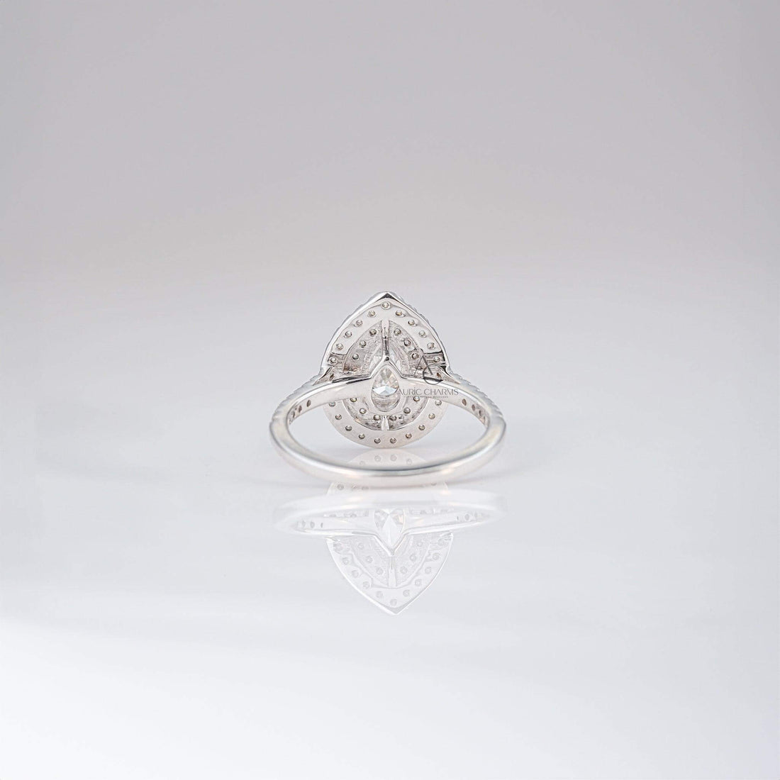 Rear view of a pear-shaped diamond ring showing intricate double halo craftsmanship.