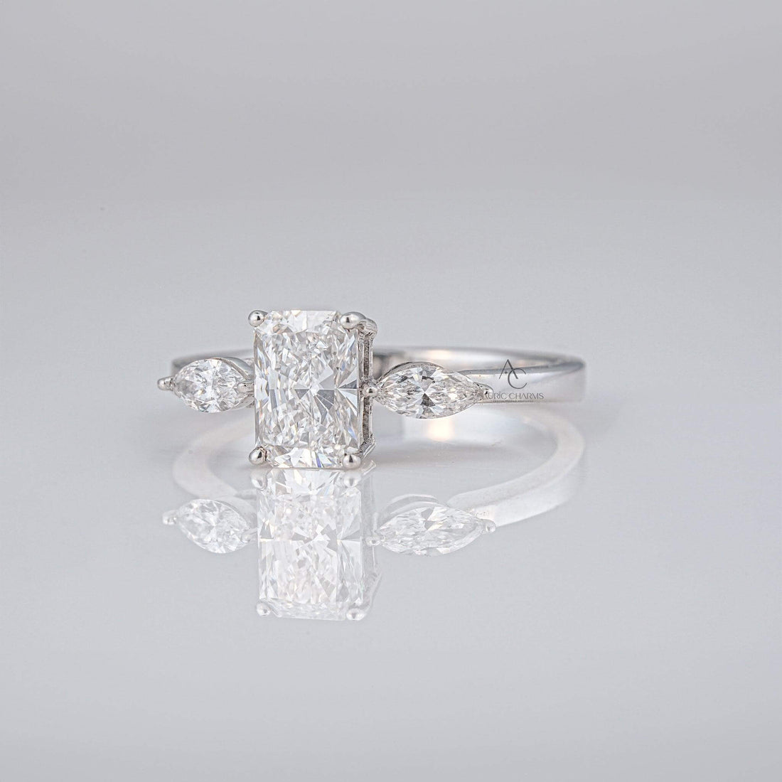 Radiant cut diamond lab-grown engagement ring with marquise side stones, highlighting its brilliance and eco-friendly appeal.