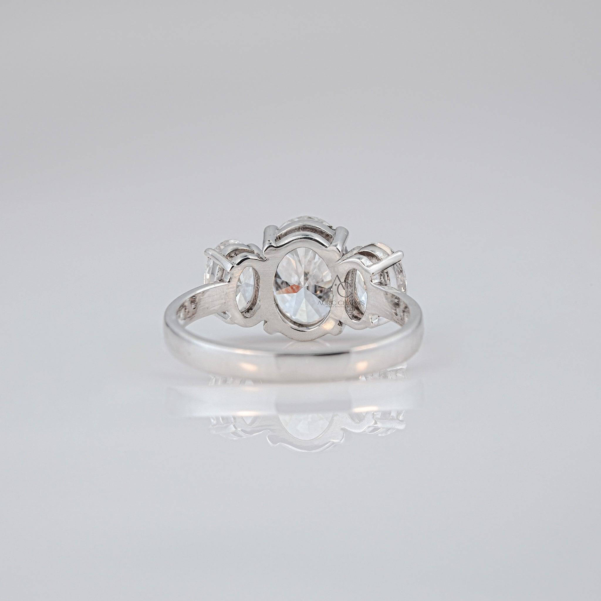 Detailed craftsmanship of three-stone lab-grown diamond ring with elegant oval-shaped diamonds.