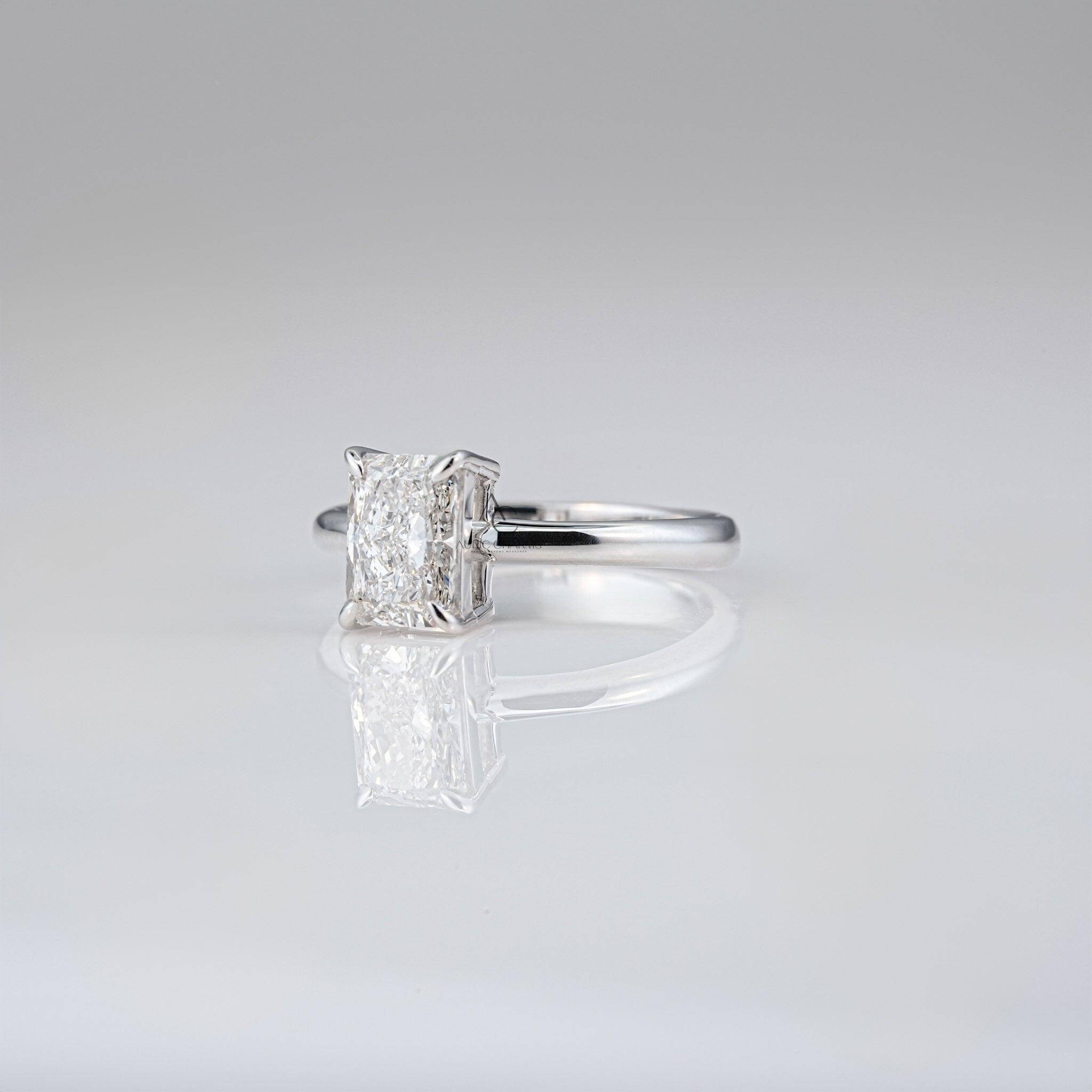Side view of radiant diamond ring with classic prong setting and white gold craftsmanship.