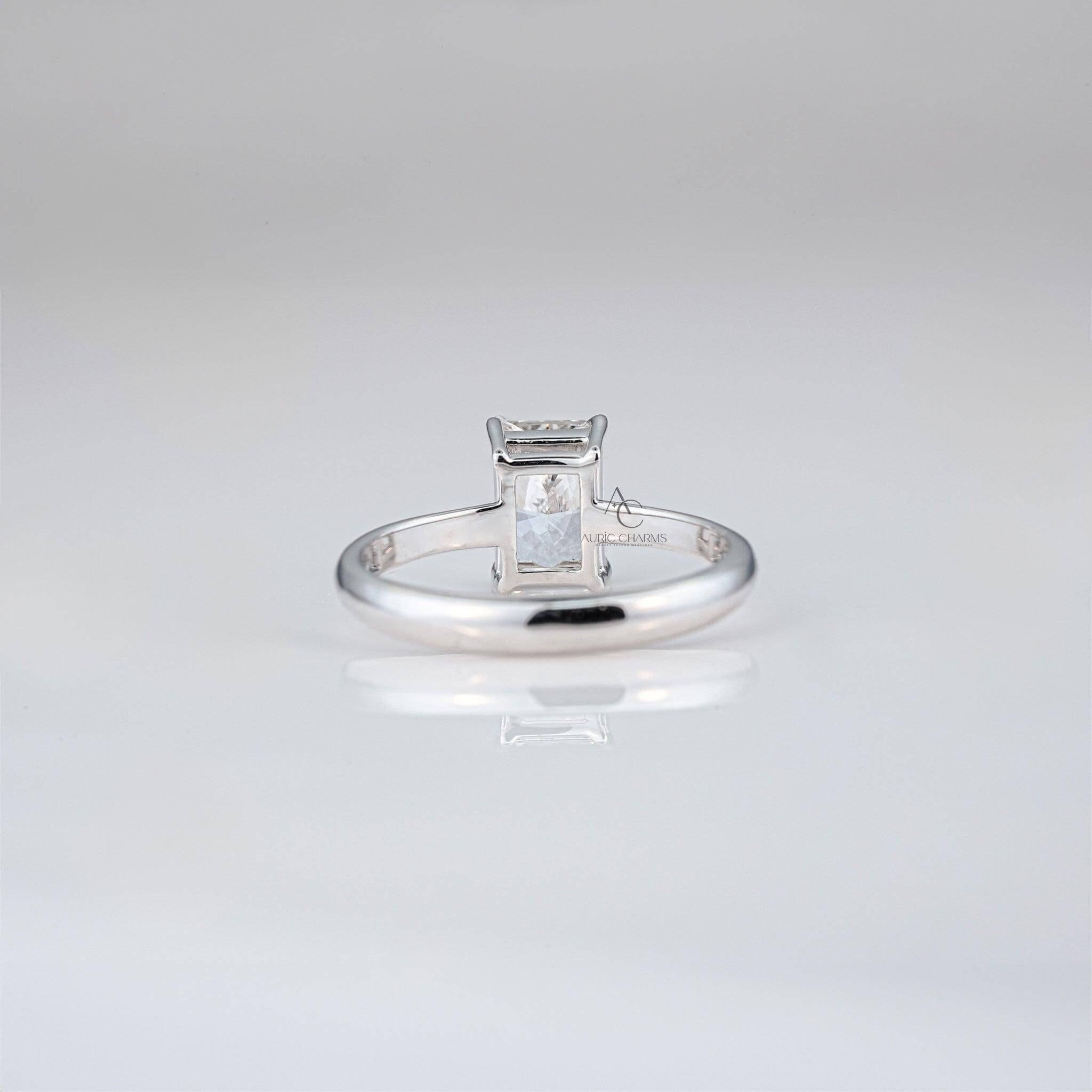 Rear view of radiant-cut diamond ring showcasing minimalistic band and secure setting.