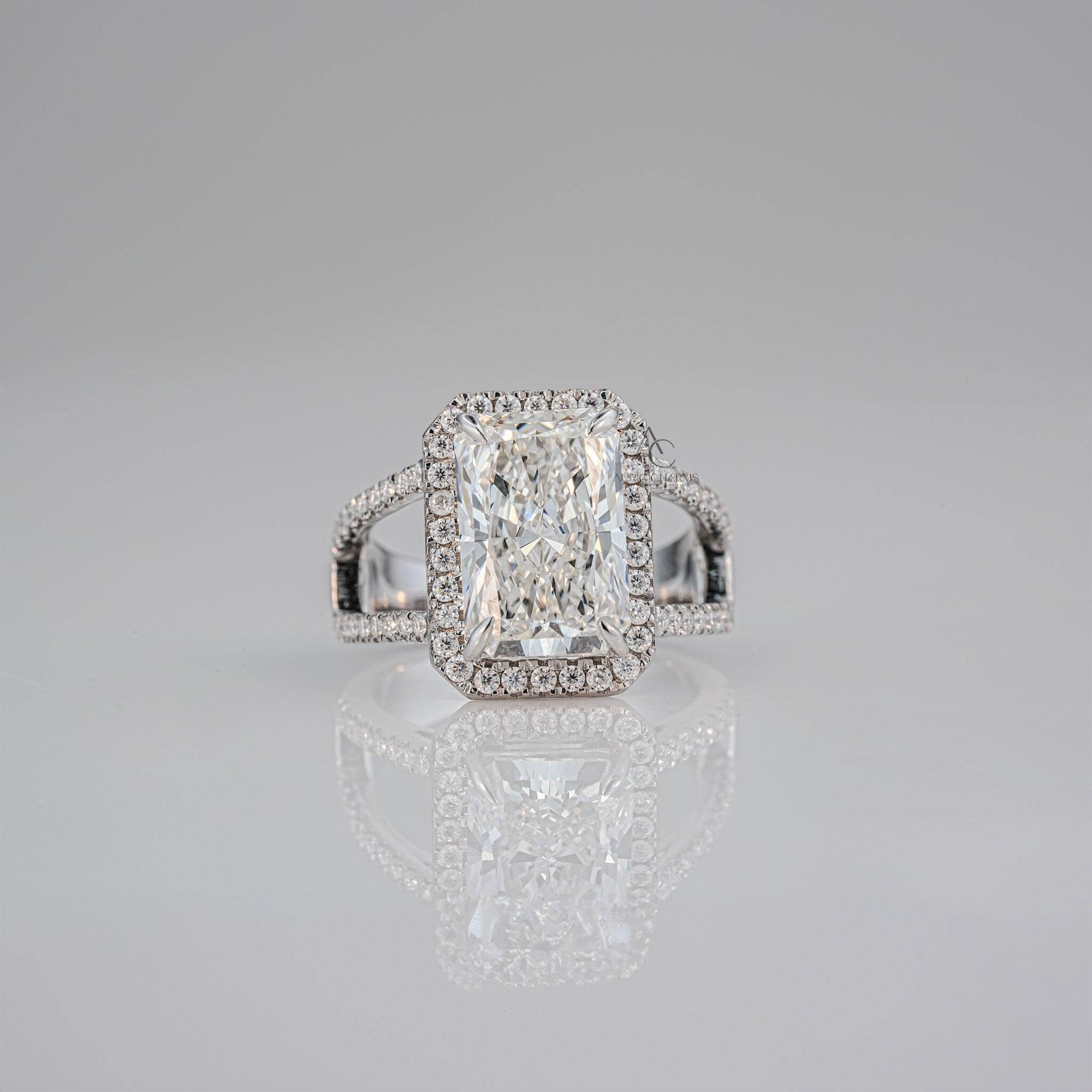 Radiant-cut diamond ring with a halo setting and intricate side detailing.