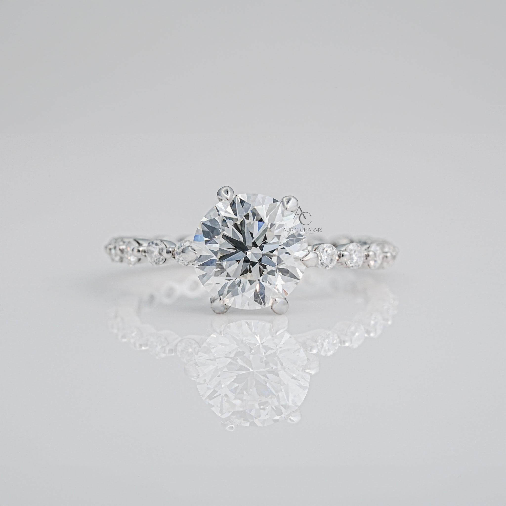 Round brilliant lab-grown diamond engagement ring with delicate pavé band.