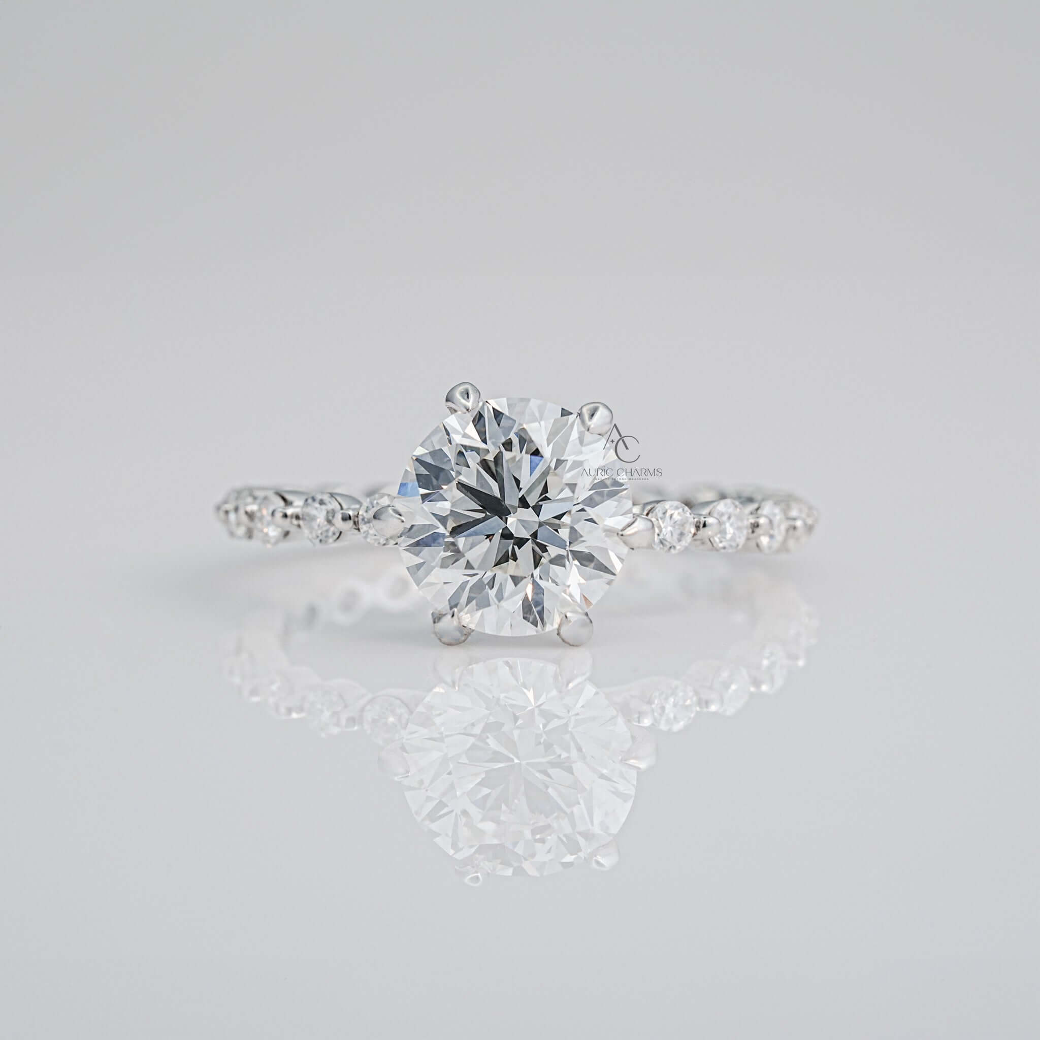 Round-cut diamond engagement ring with a sparkling pave band on display.