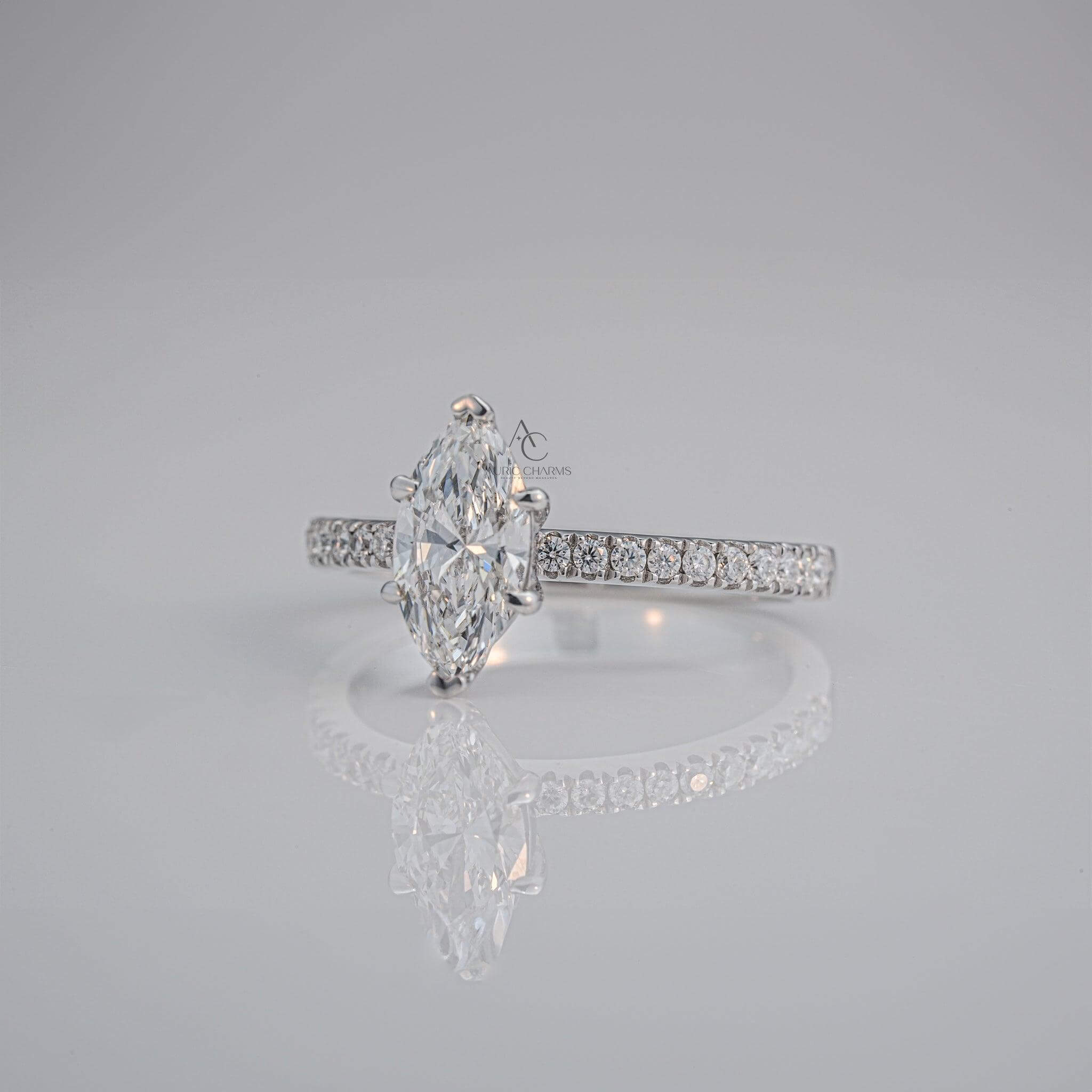 Side profile of a marquise-cut diamond ring with a sparkling pavé platinum band, showcasing its intricate craftsmanship.