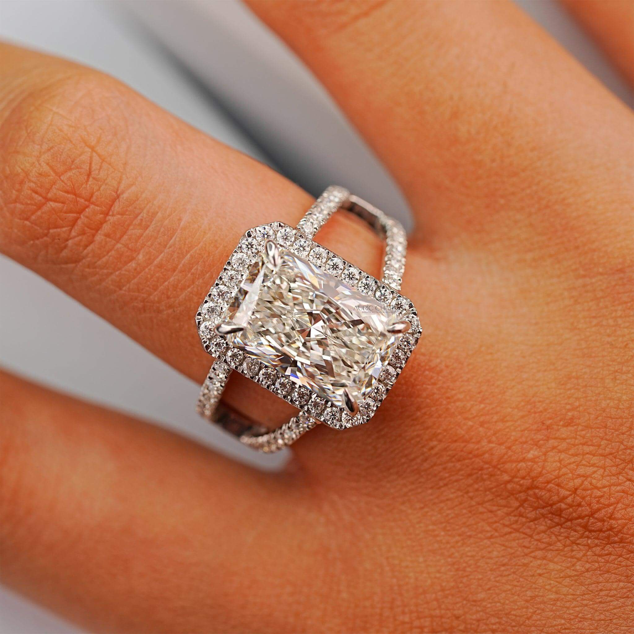Radiant-cut diamond ring with halo setting displayed on hand for style inspiration.