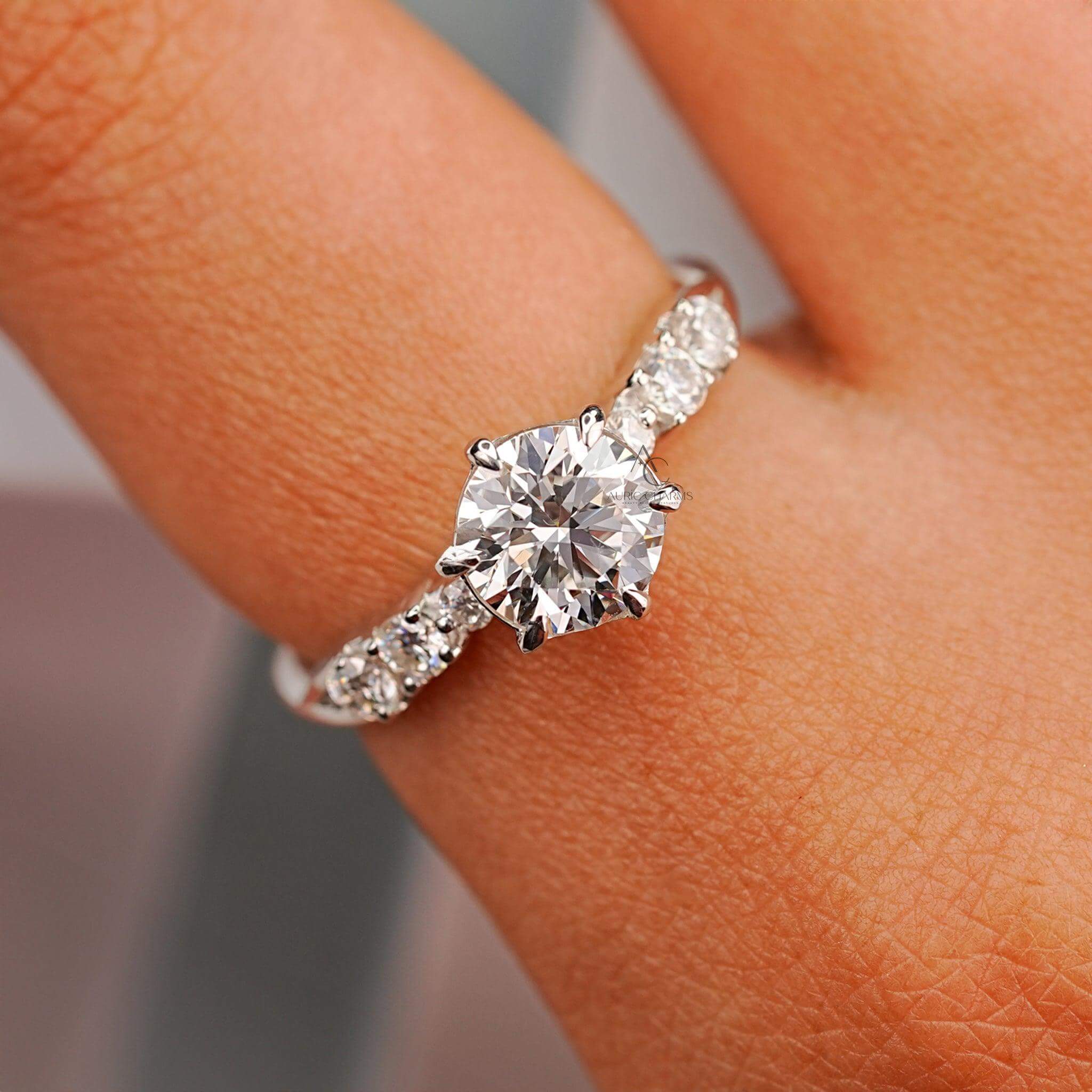 Round cut diamond engagement ring in six-prong solitaire setting with elegant sparkle.