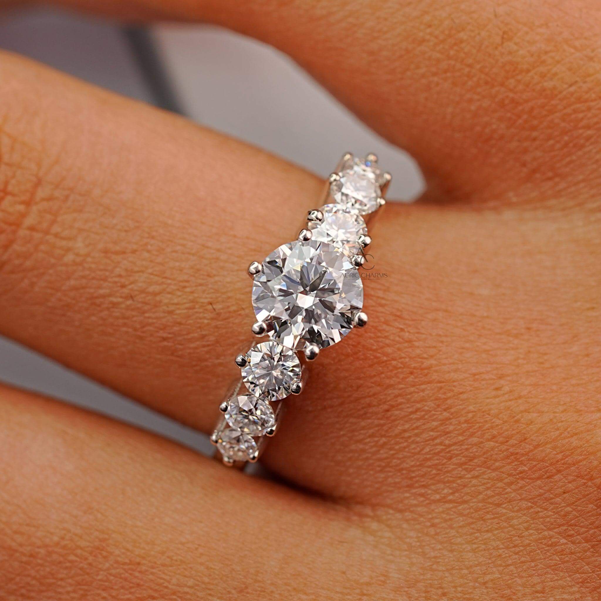 Stylish diamond ring with a round-cut centerpiece and reflective modern elegance.