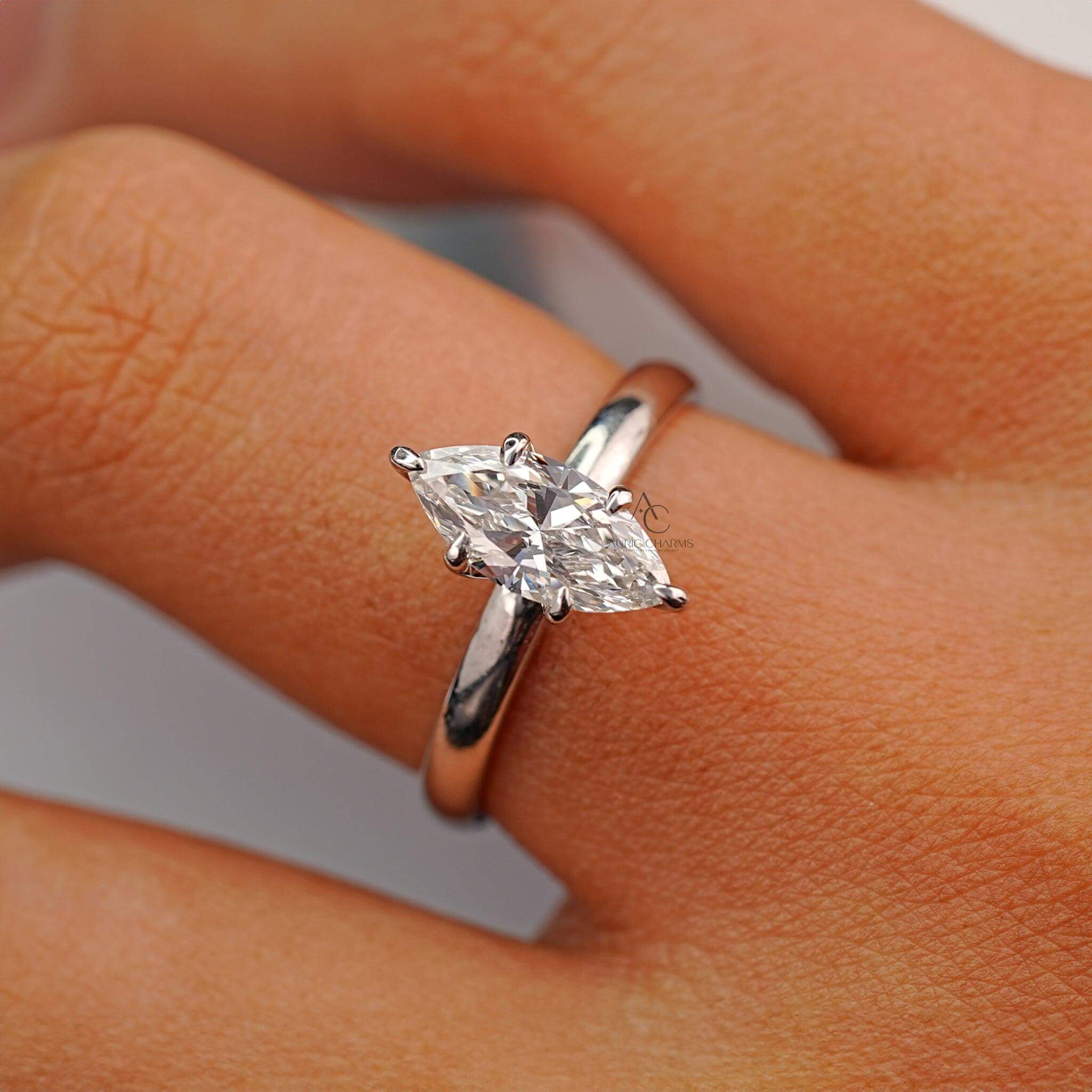 Close-up image of the marquise-cut diamond ring on a finger, illustrating the ring's luxurious yet simple aesthetic.