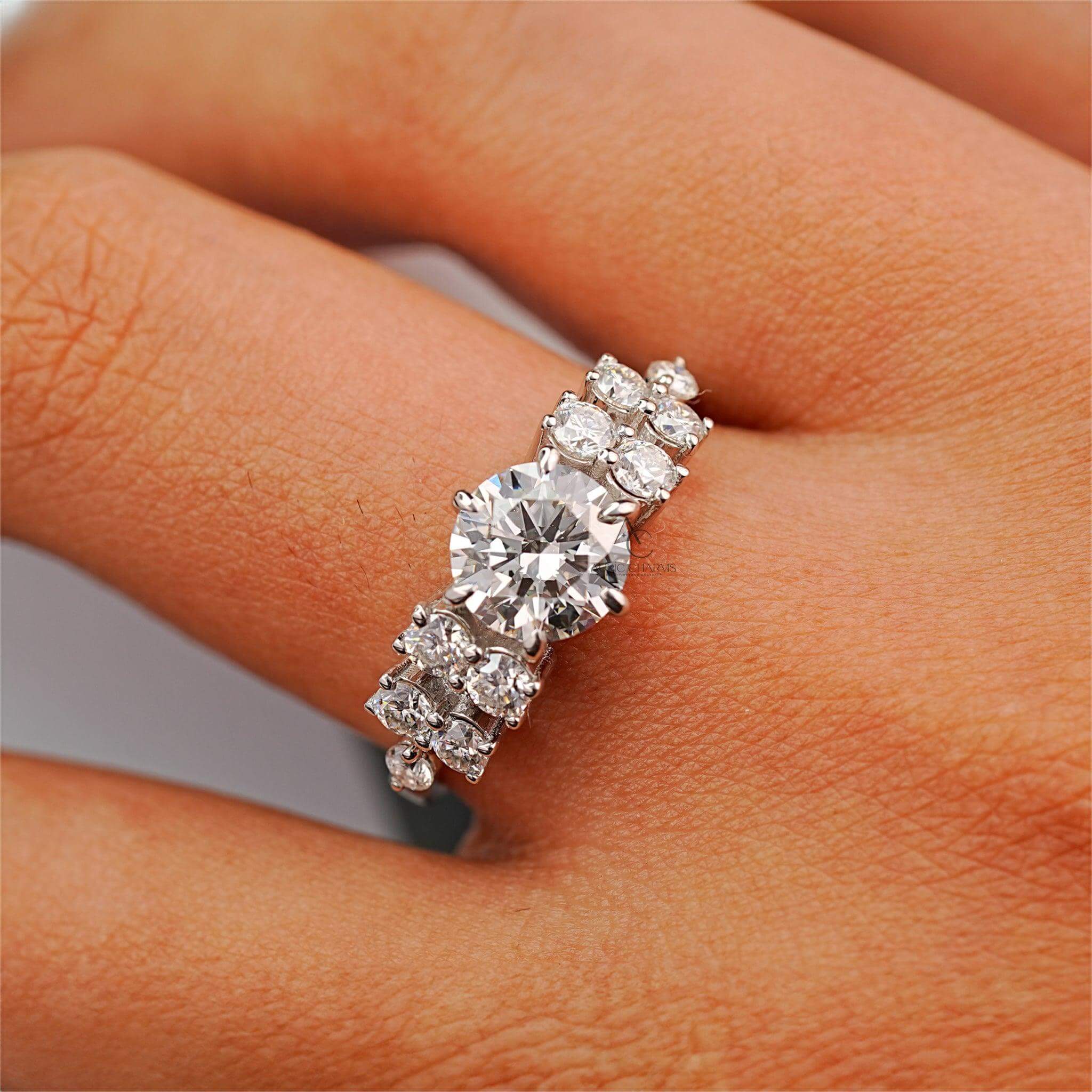 Round diamond solitaire ring worn on hand, elegant and luxurious design perfect for special occasions.