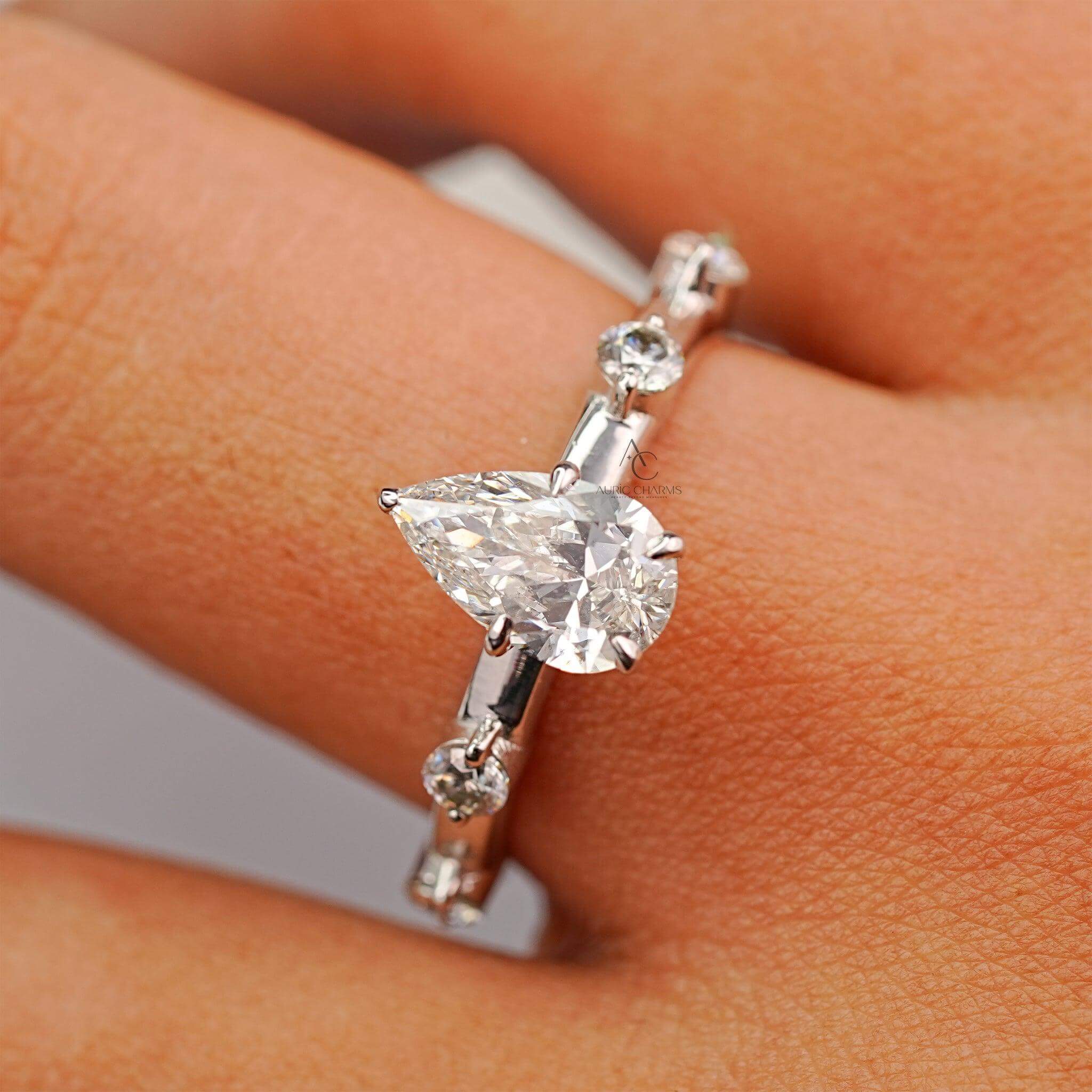 Close-up of pear-shaped lab-grown diamond engagement ring with intricate detailing, reflecting modern and ethical luxury.