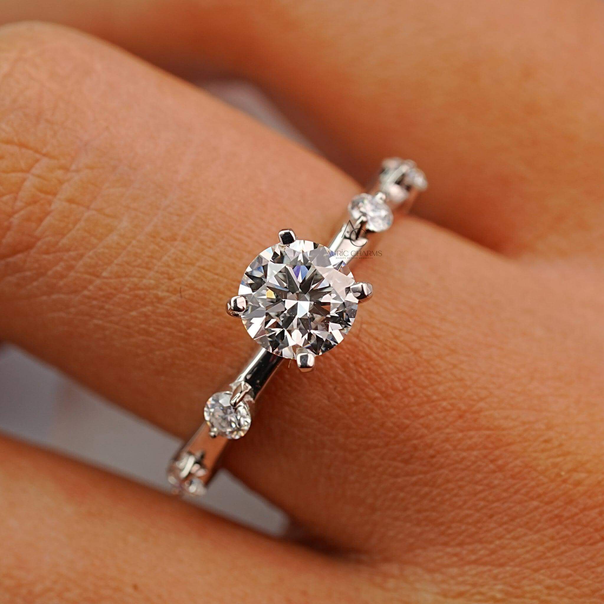 Close-up of a diamond ring on a finger with a classic white gold setting.