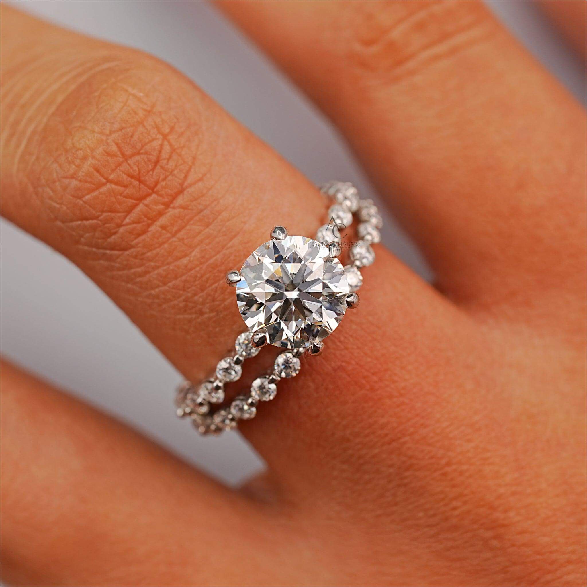 Round diamond engagement ring in six-prong setting, paired with a diamond eternity band.
