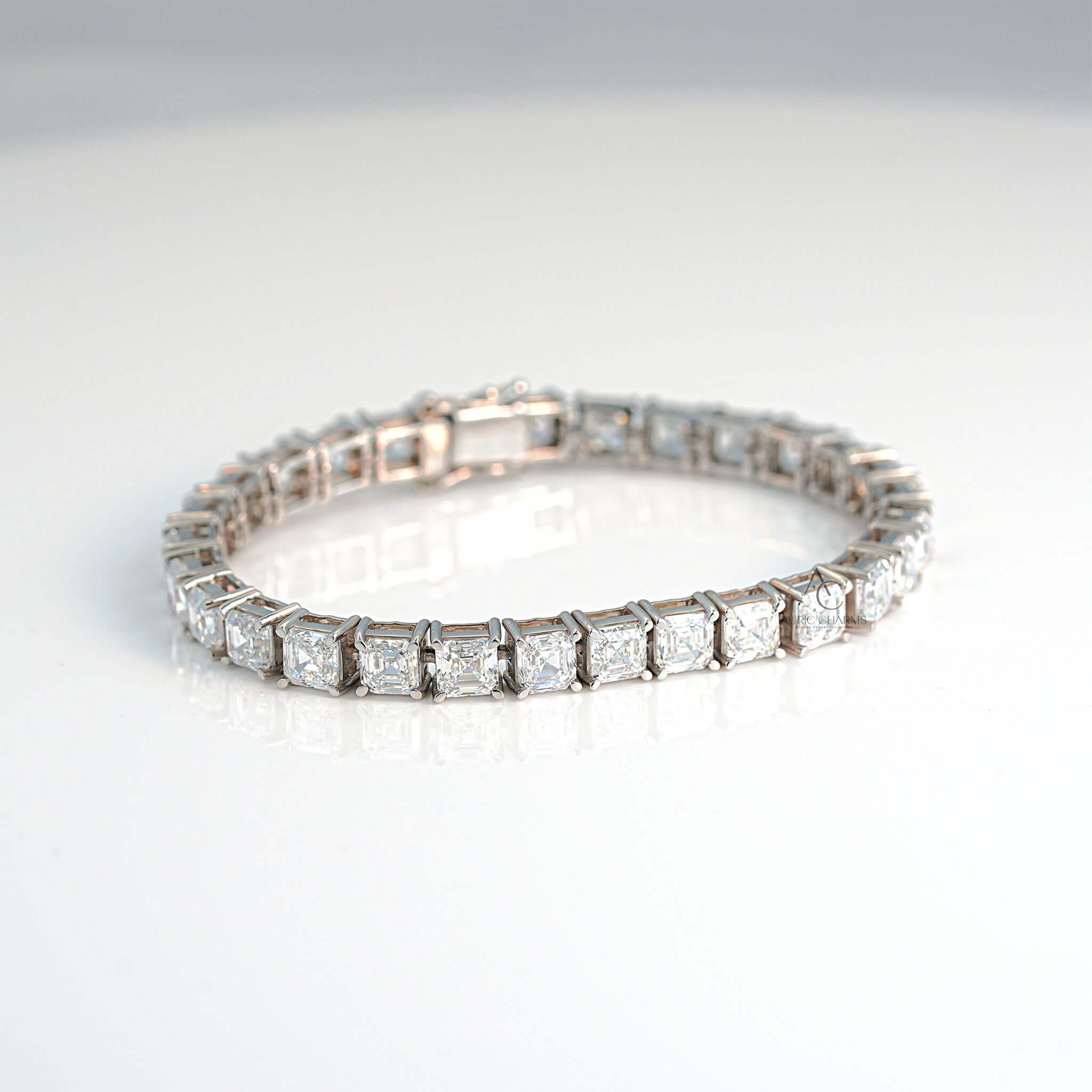 White gold tennis bracelet with princess-cut lab-grown diamonds and secure clasp.