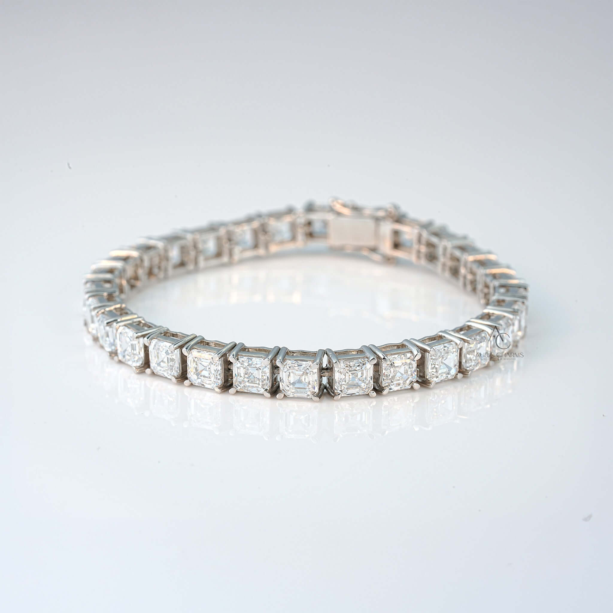 Close-up of white gold bracelet with princess-cut lab-grown diamonds and polished finish.