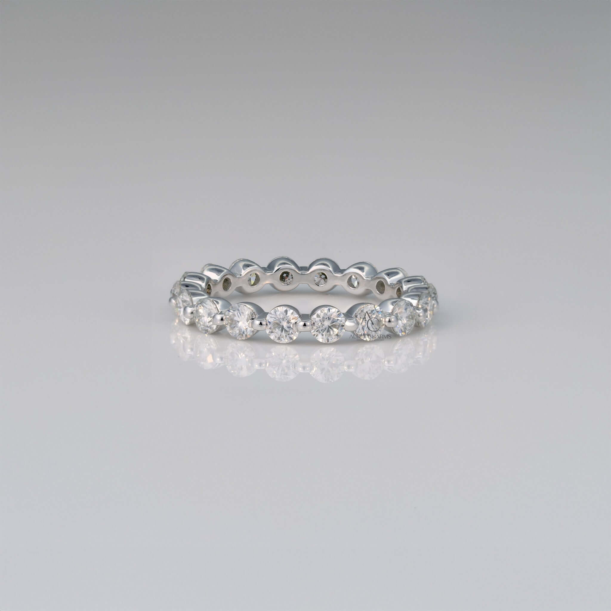 Eternity band with round lab-grown diamonds in white gold.
