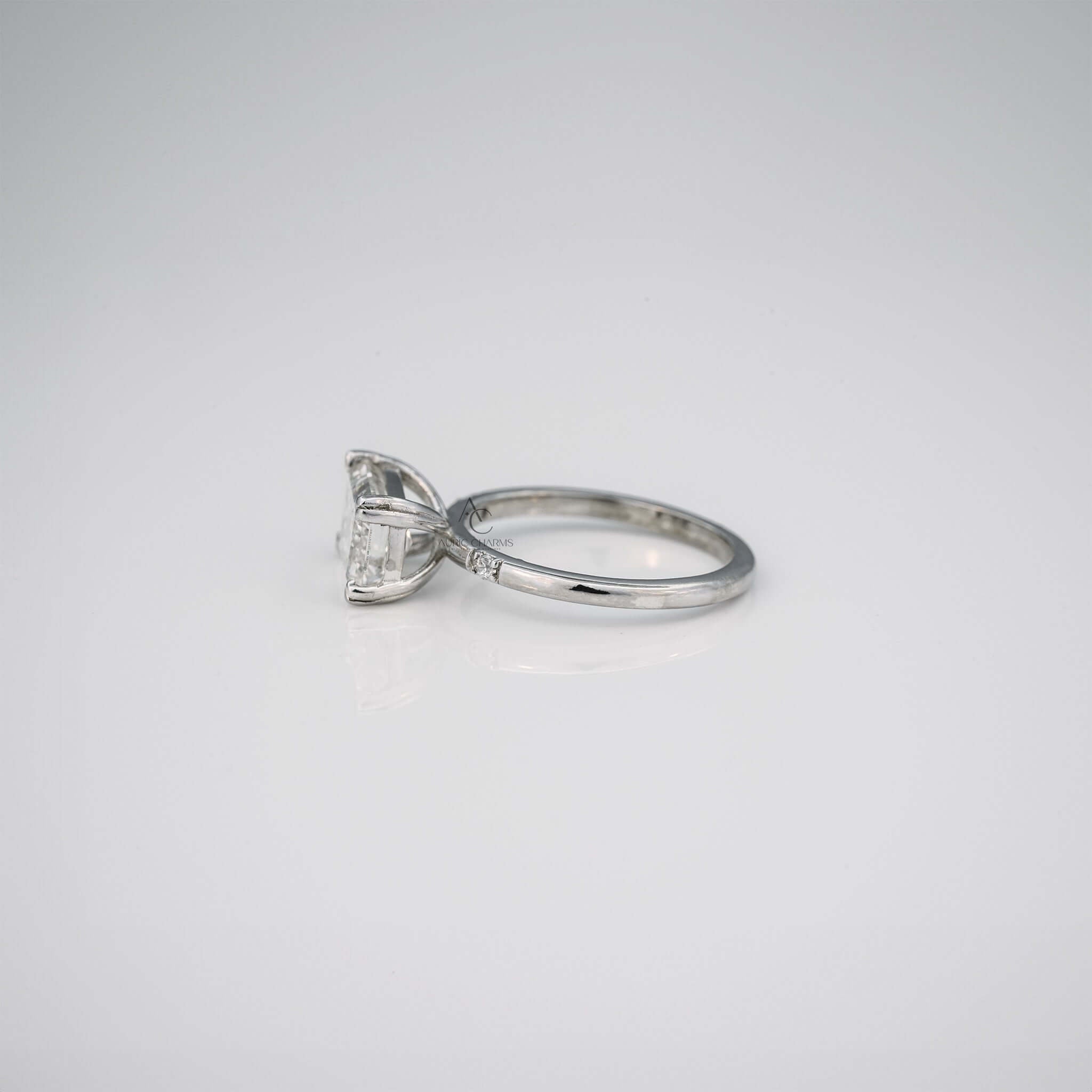 Elara Emerald Three-Stone Diamond Engagement Ring