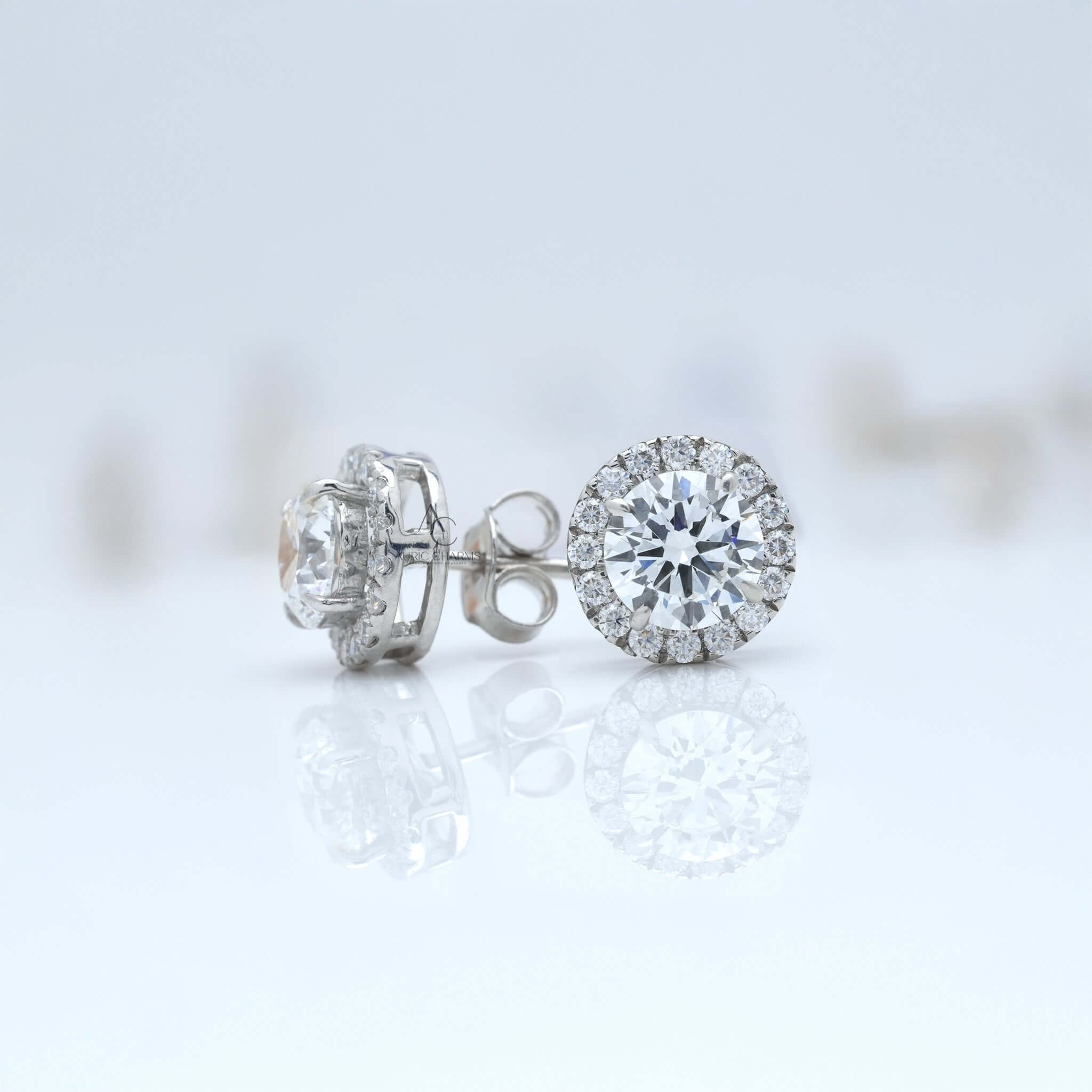Round brilliant lab-grown diamond halo stud earrings in white gold, with side profile view.