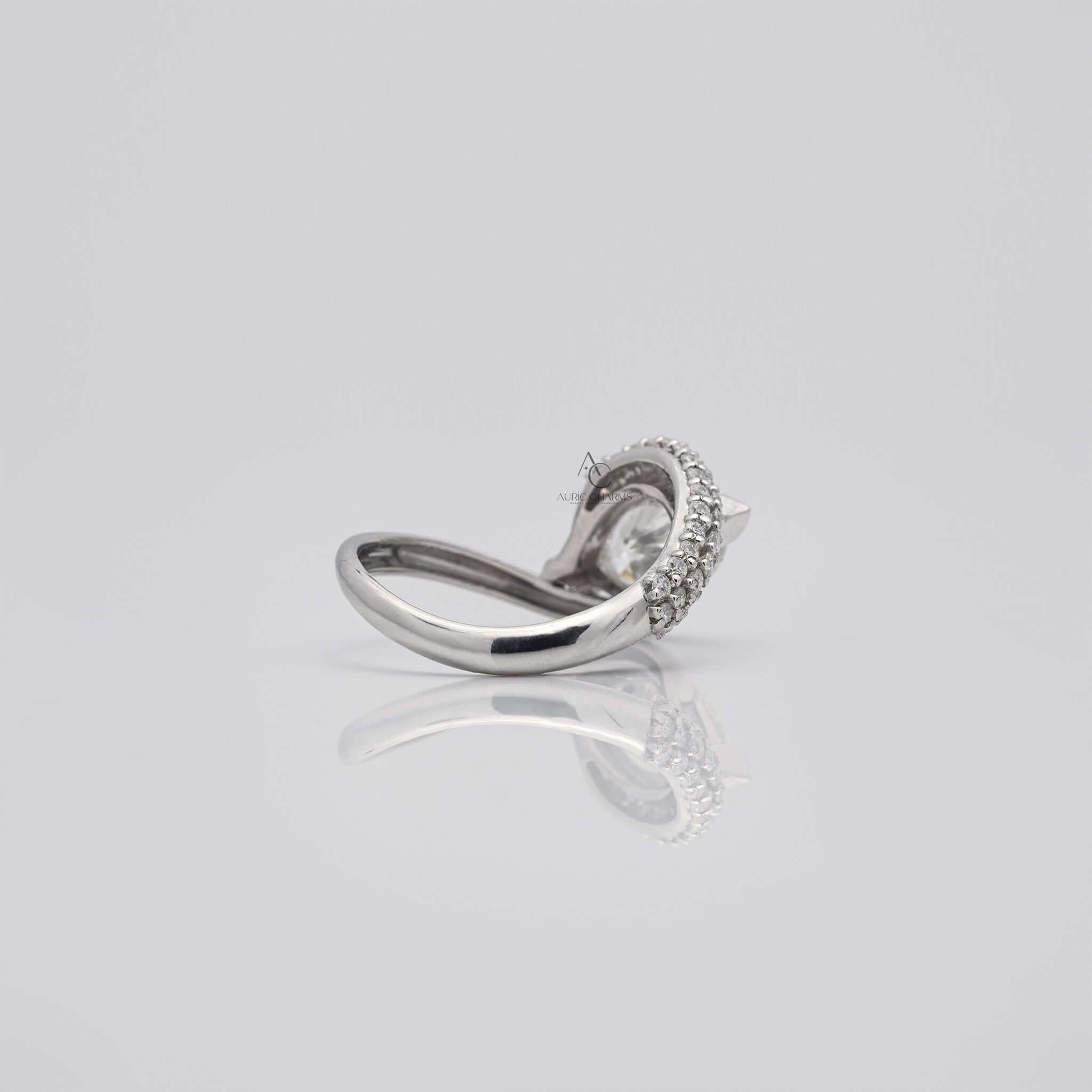 Rear view of pear diamond ring showcasing band curvature and stone setting.