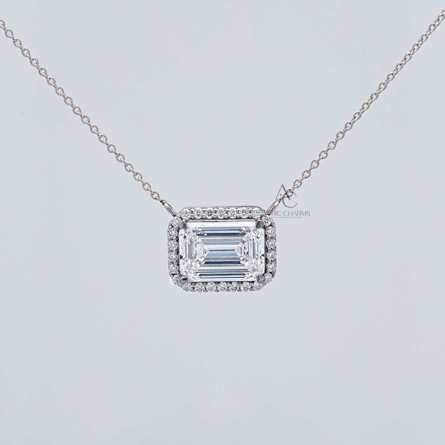 Zendaya Emerald East-West Halo Diamond Pendant