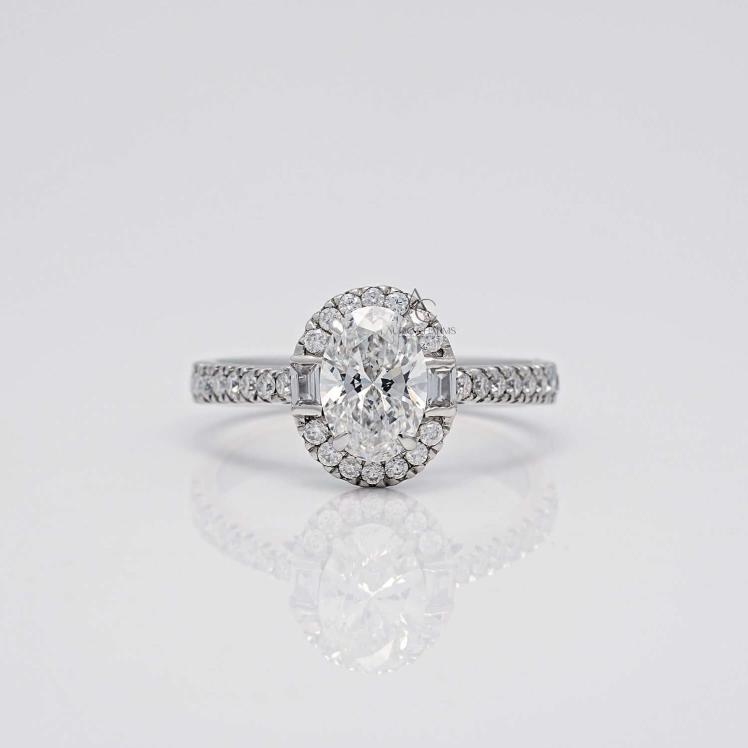 Oval diamond engagement ring with halo and pave band.