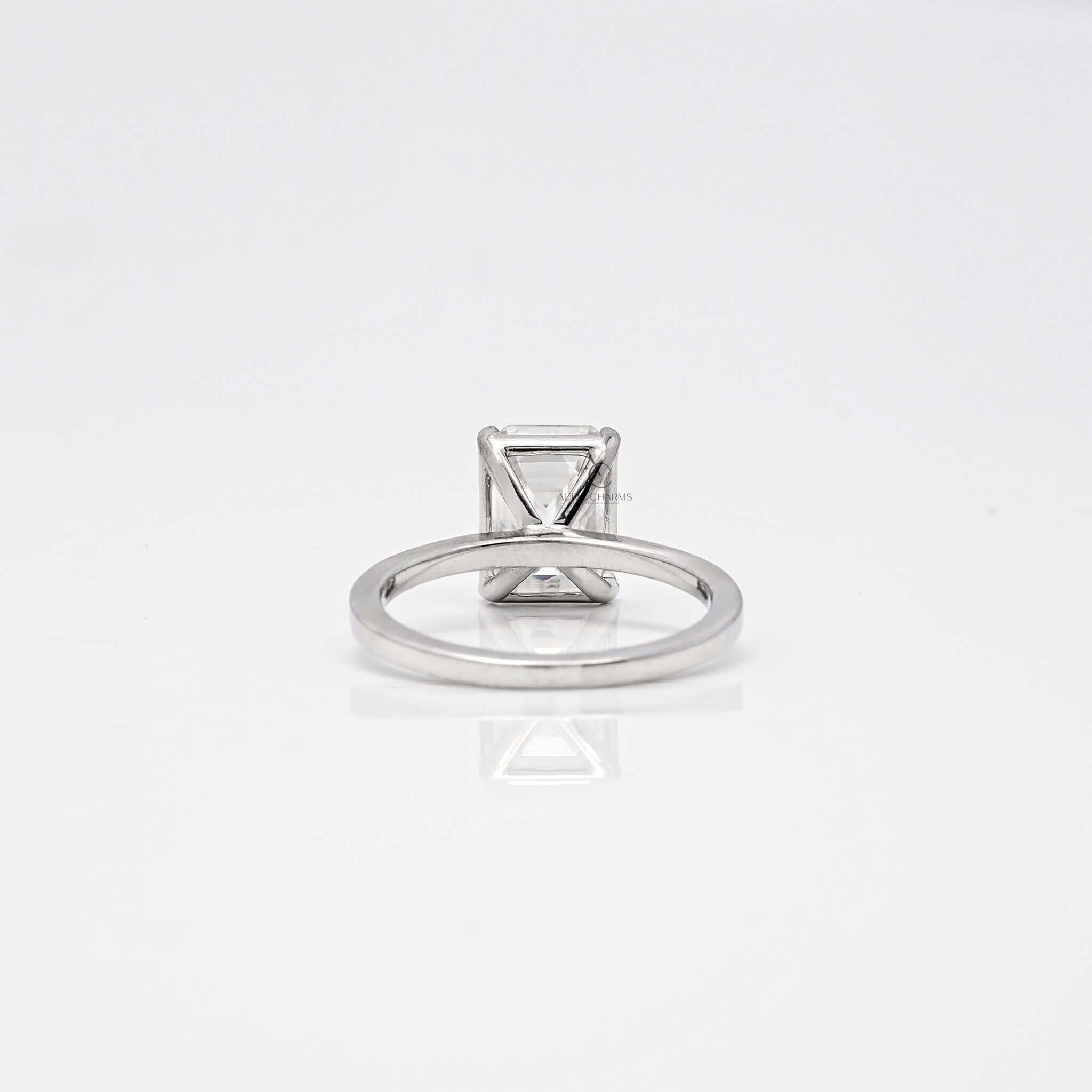 Back view of emerald diamond solitaire setting.